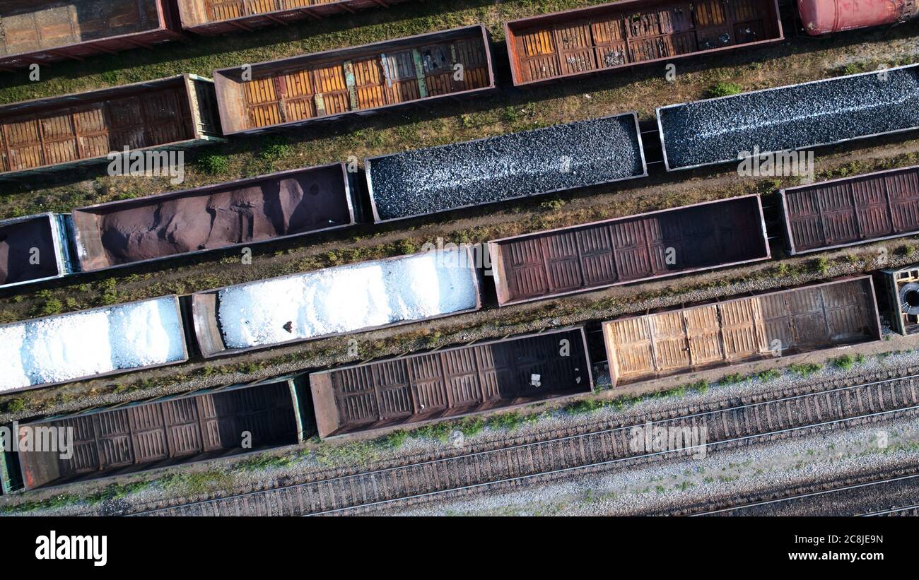Aerial view of rail sorting freight station with railway cars, with
