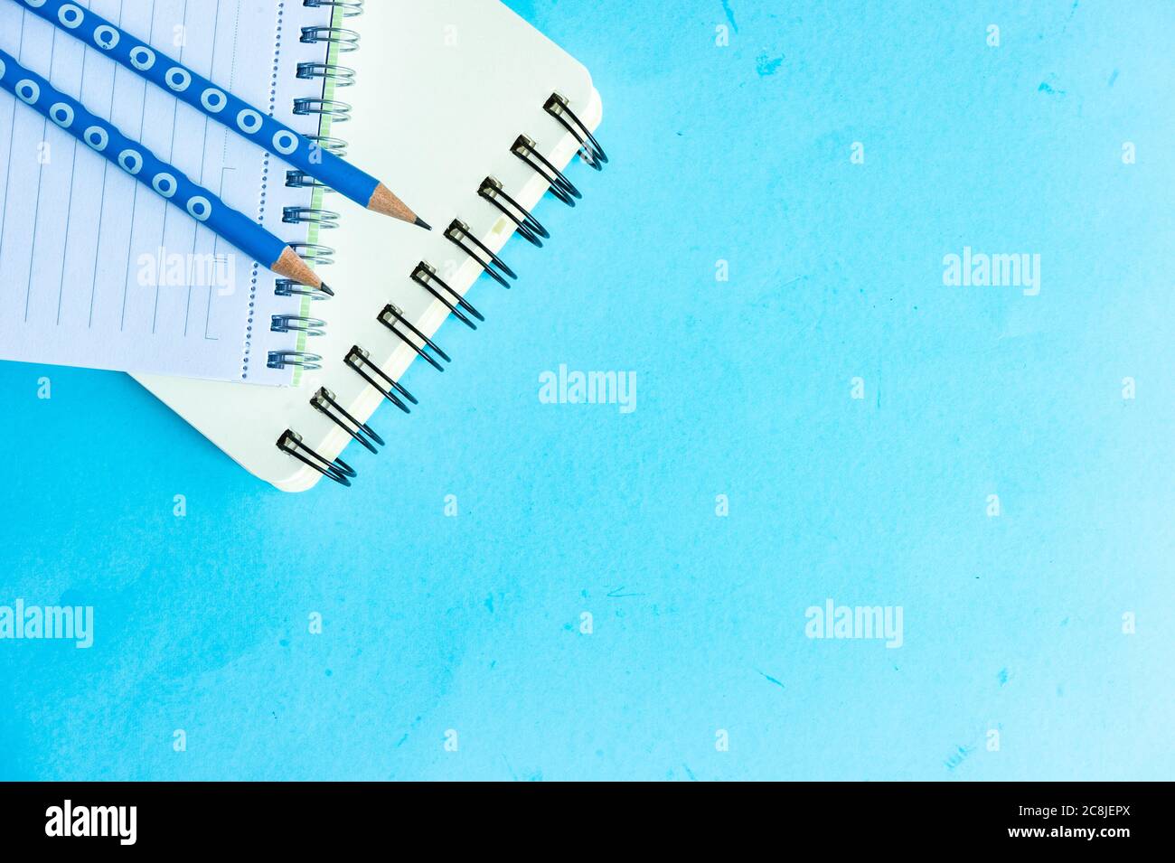 Back to School flatlay on blue background with copy space Stock Photo
