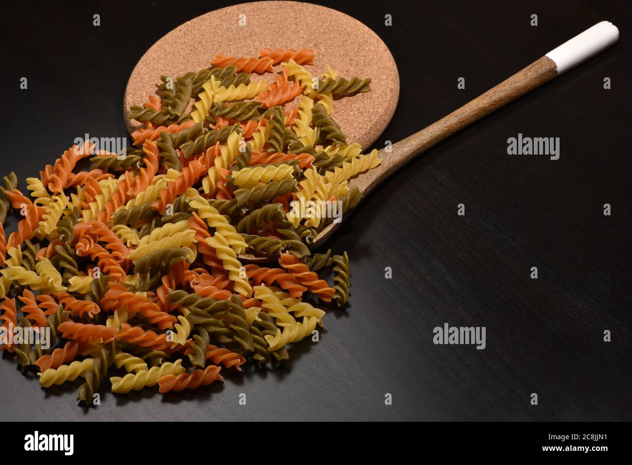 Three Colors Rotini Pasta. Twisted colored pasta in Italy Stock Photo