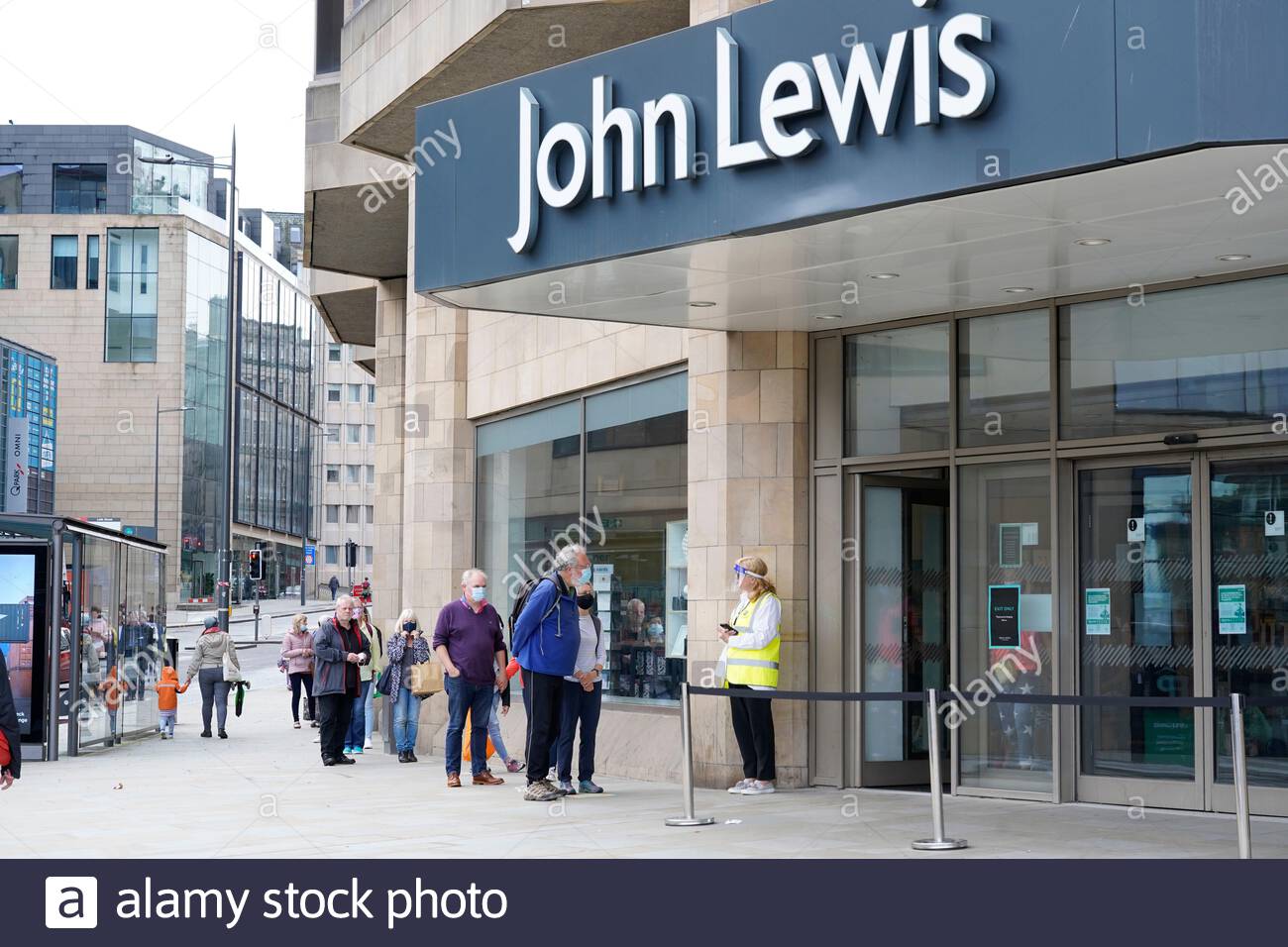 Edinburgh, Scotland, UK. 25th Jul 2020. Saturday shoppers wearing facemasks in a socially distanced queue for controlled entry to John Lewis department store.  Credit: Craig Brown/Alamy Live News Stock Photo