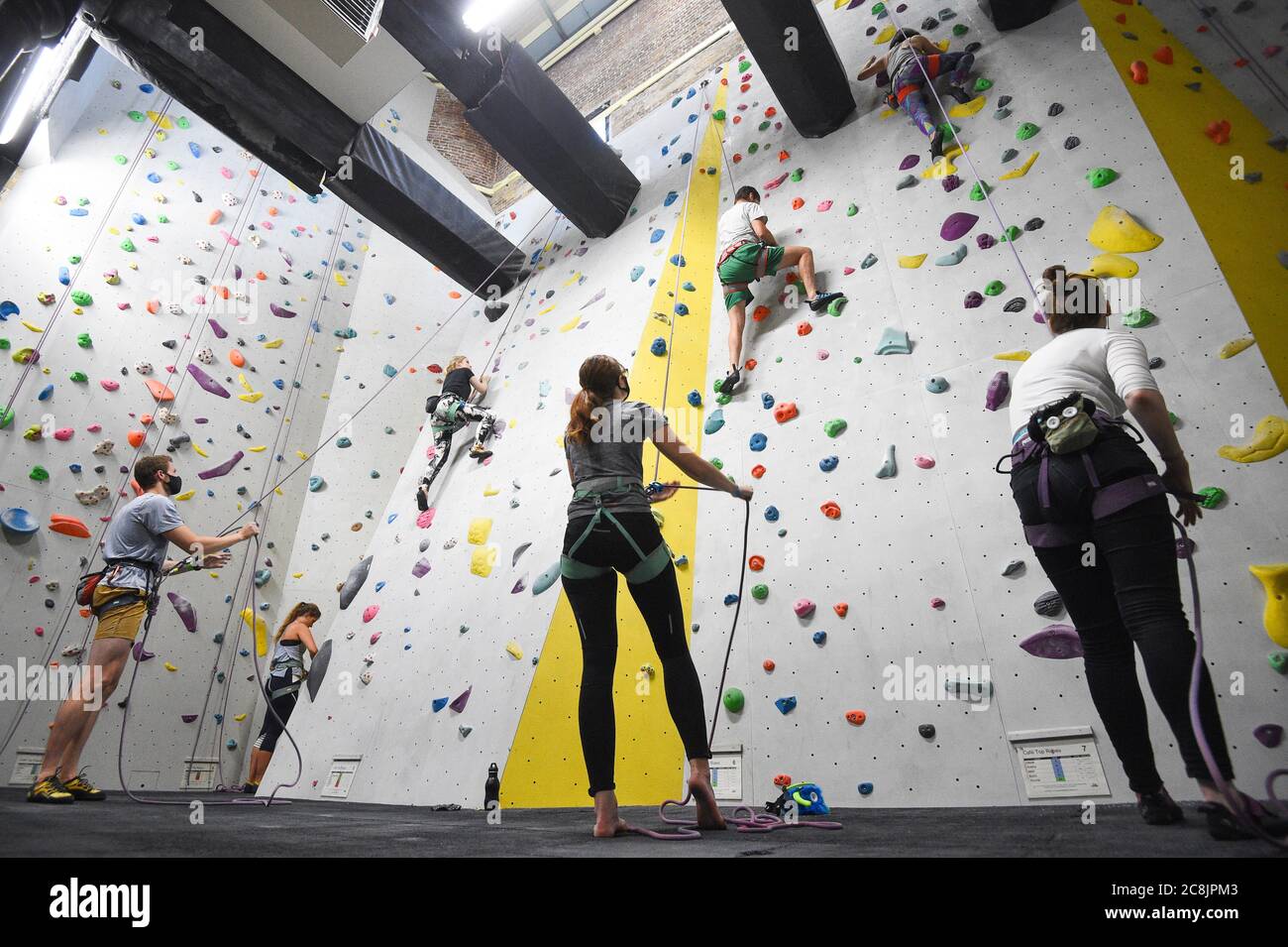 Climbers at The Castle Climbing Centre, near Finsbury Park in north London, as indoor gyms, swimming pools and sports facilities can reopen as part of the latest easing of coronavirus lockdown measures in England. Stock Photo