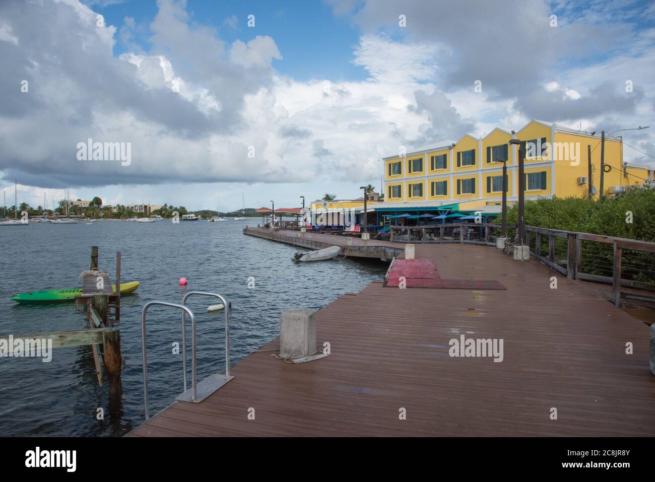 Christiansted, St. Croix, VI-October 19,2019: Boardwalk with view of harbor vessels and Rum Runners Restaurant in St. Croix in the USVI Stock Photo