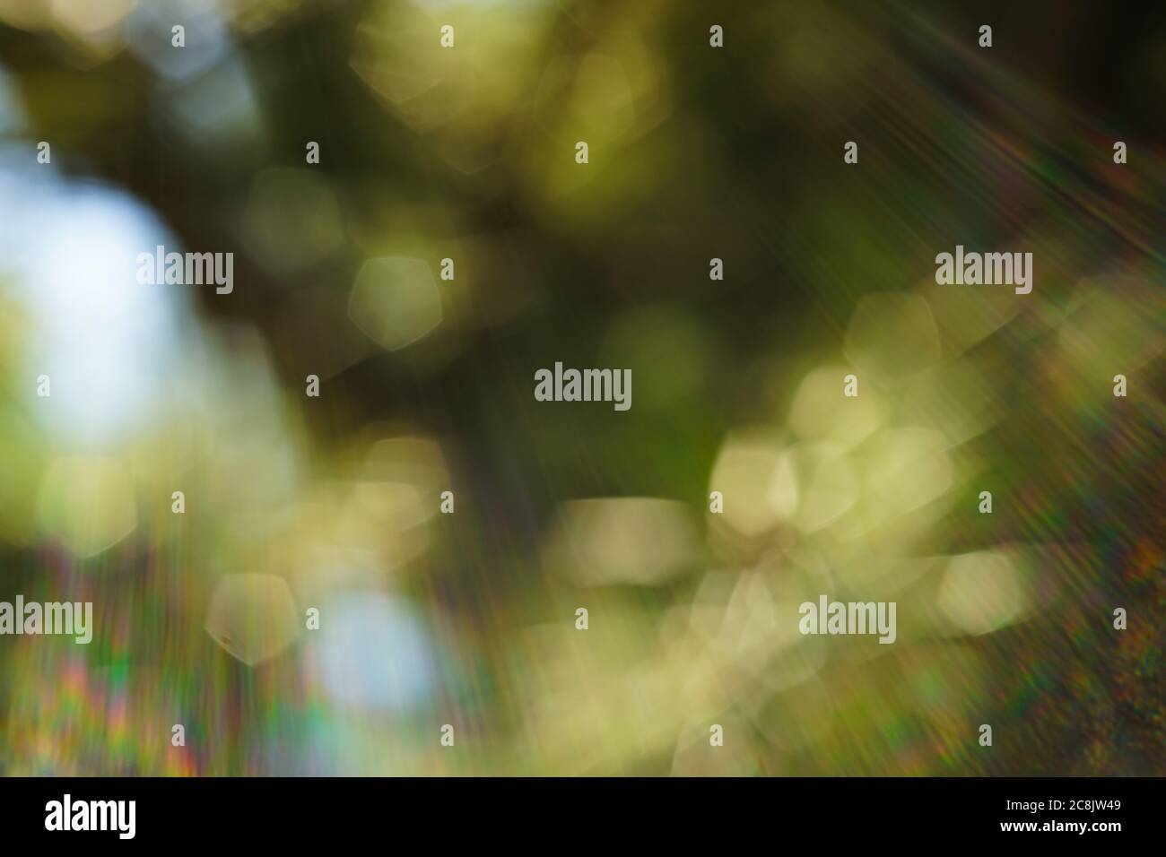 Blurred bokeh background with solar glow spectrum rays of all shades Stock Photo