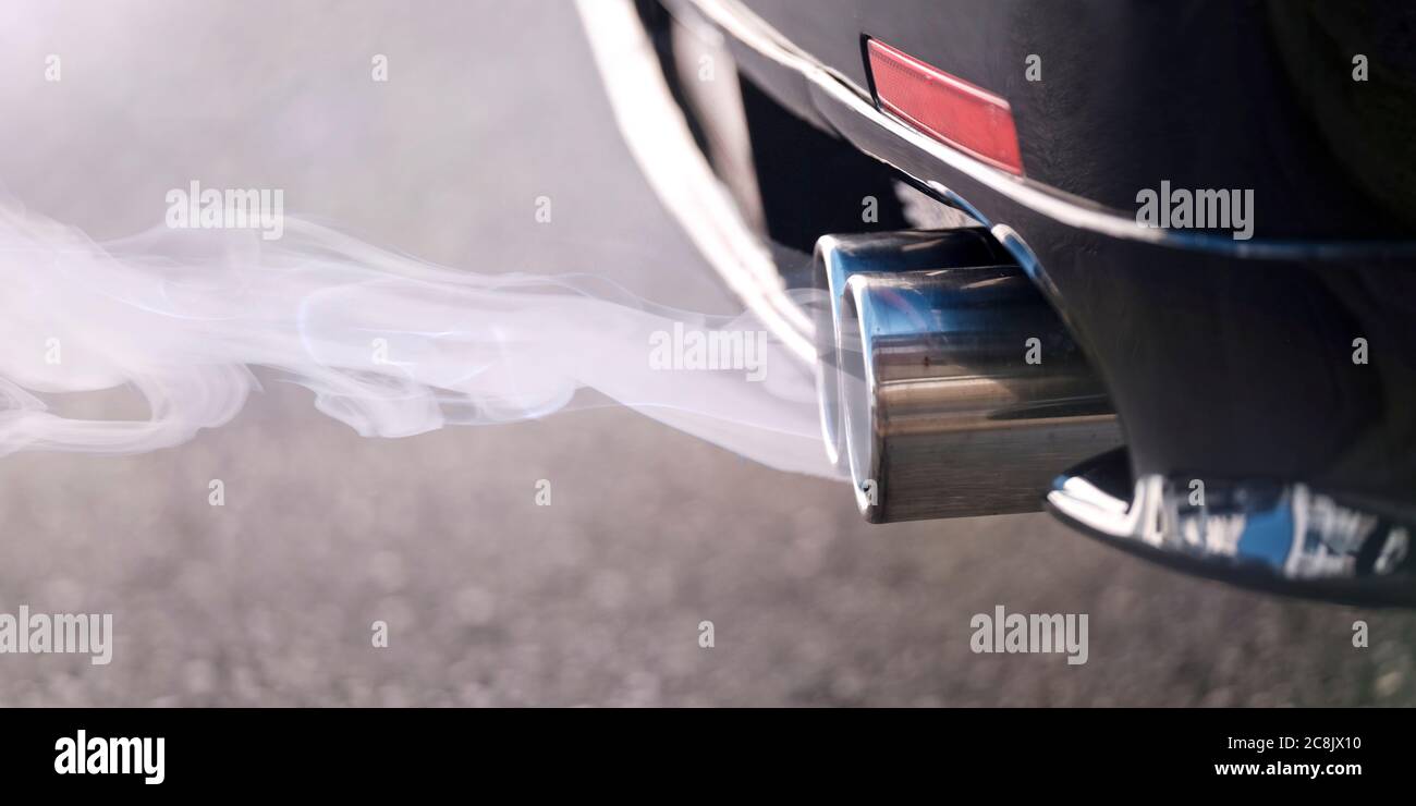 Smoky dual exhaust pipes from a starting diesel car Stock Photo Alamy