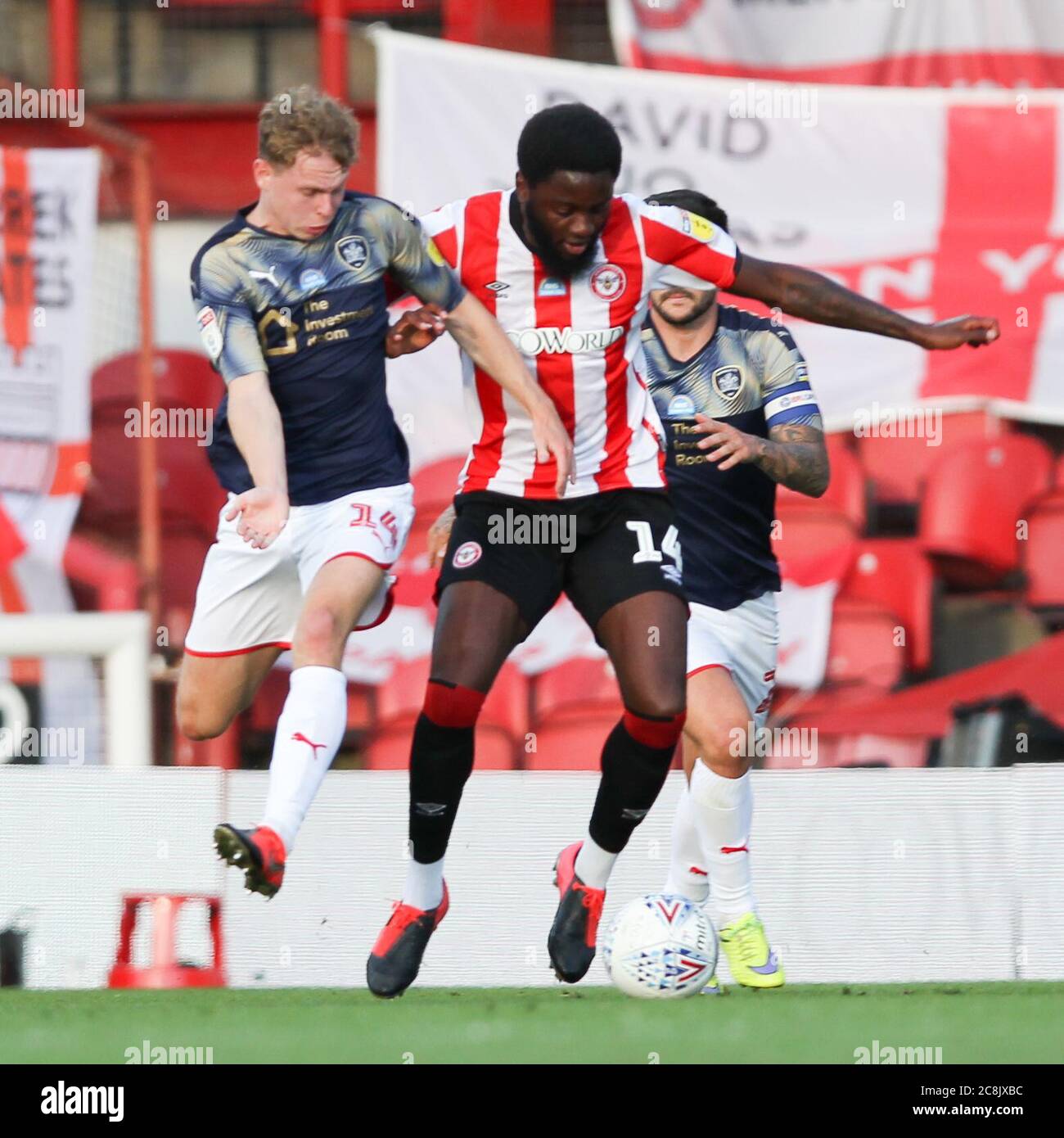 London Uk 25th July 2020 Josh Dasilva Of Brentford And Kilian Ludewig Of Barnsley Challenge For The Ball During The Efl Sky Bet Championship Match Between Brentford And Barnsley At Griffin Park