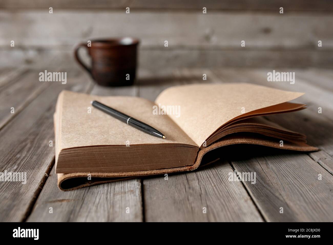 Office desk with blank screen smartphone,pen,notebook and coffee cup on wood table.Top view with copy space.Office supplies and gadgets on desk table.Working desk table concept.Flat lay image. Stock Photo