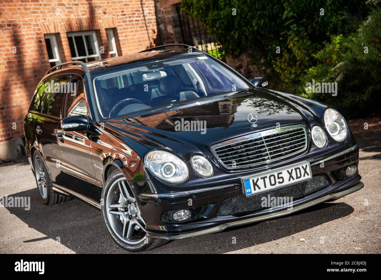 Mercedes Benz E55 Estate Car Parked On A Drive In Front Of A Georgian House In A Leafy Suburb On A Summer Afternoon Stock Photo Alamy