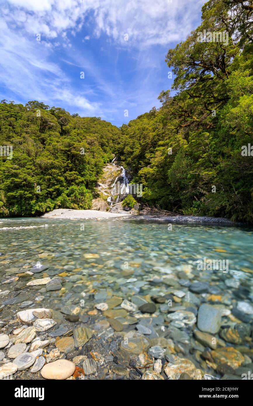 The Fantail Falls, waterfall, in the Haast Pass flowing into the Haast River at the trailhead of the Brewster Track. Mount Aspiring National Park, Sou Stock Photo