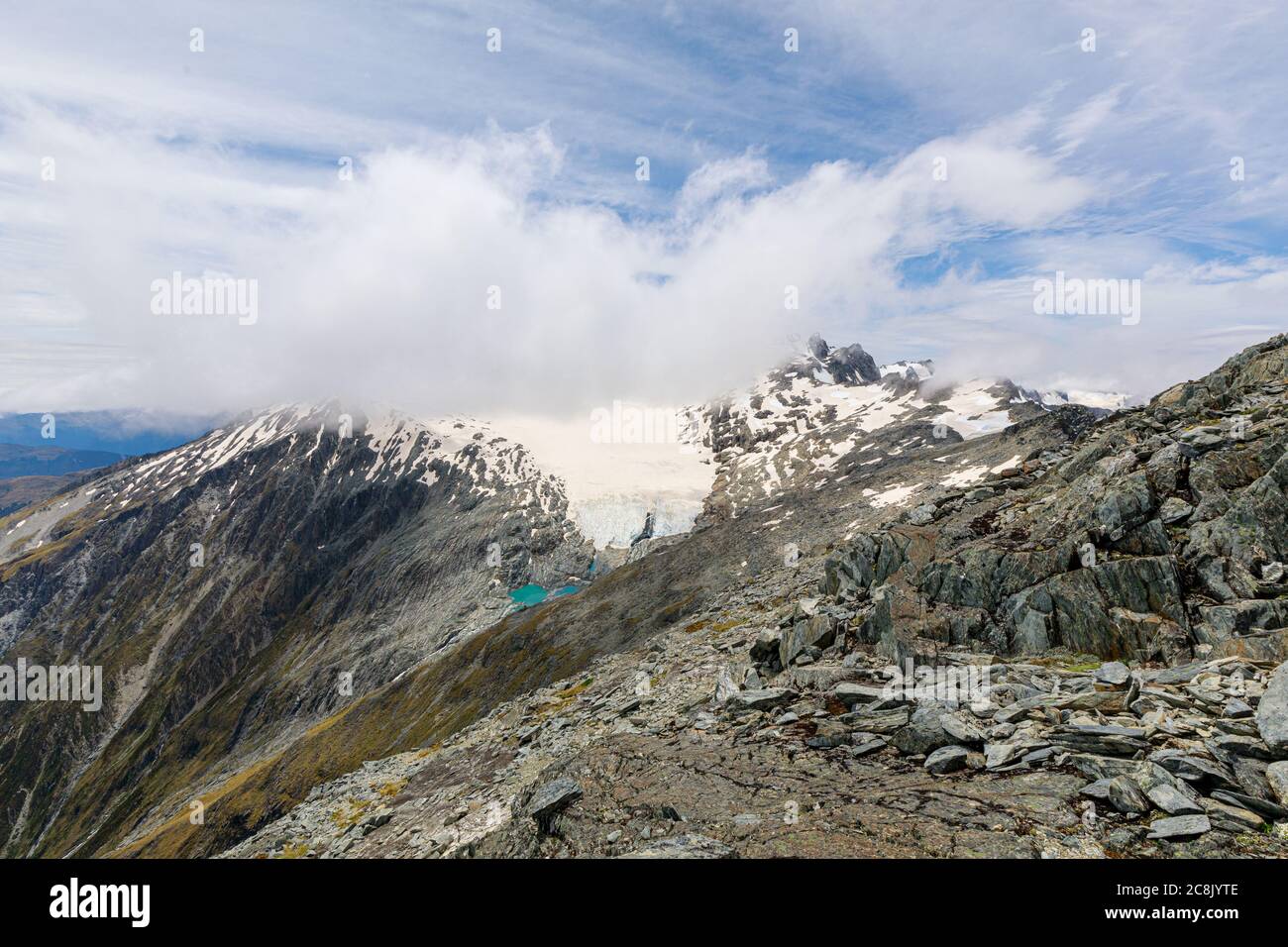 View of a glacier on Mt Brewster from the summit of Mt Armstrong on the Brewster Track in Mount Aspiring National Park, South Island, New Zealand. Stock Photo