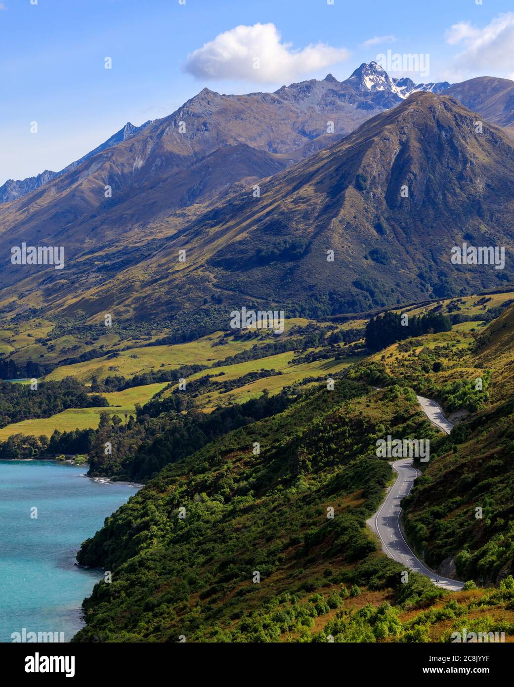The road between Glenorchy and Queenstown next to Lake Wakatipu. From the view of Bennetts Bluff Lookout towards the mountains. Stock Photo