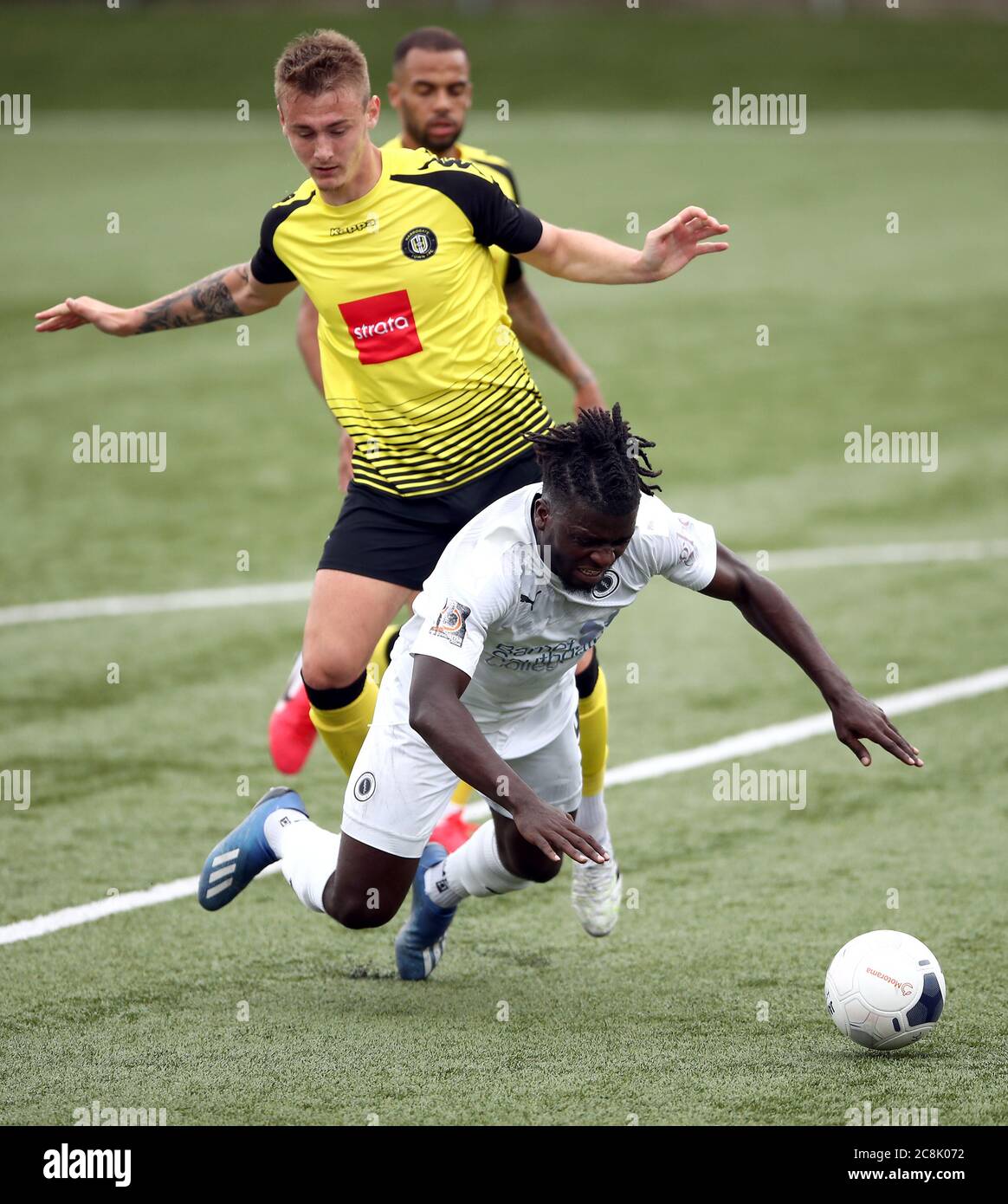 Boreham Wood's Kabongo Tshimanga goes down under the challenge from Harrogate Town's William Smith during the Vanarama National League play-off semi final match at CNG Stadium, Harrogate. Stock Photo