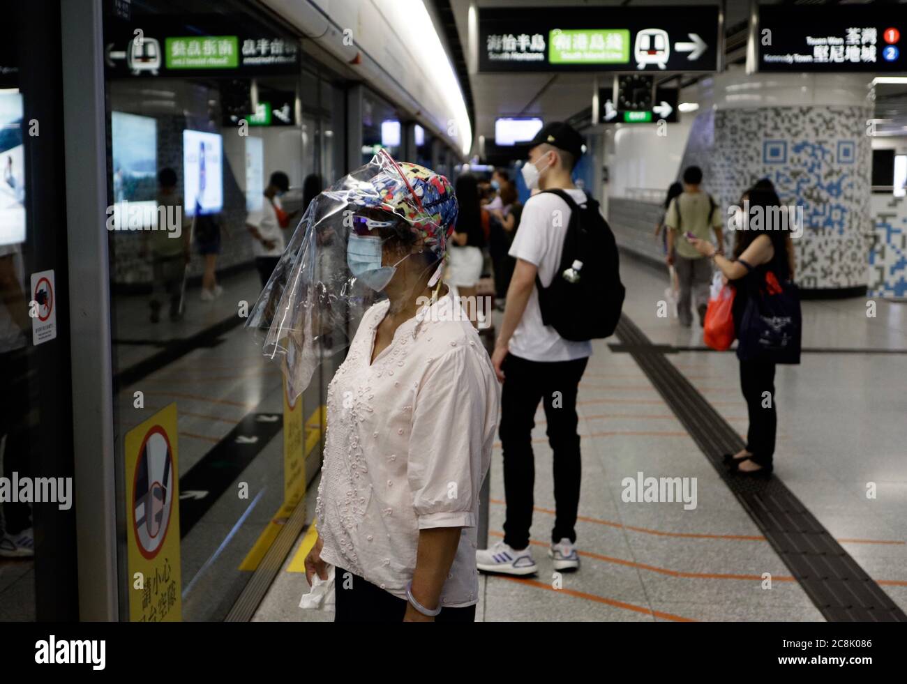 Hong Kong, CHINA. 25th July, 2020. Woman dressed in surgical mask and