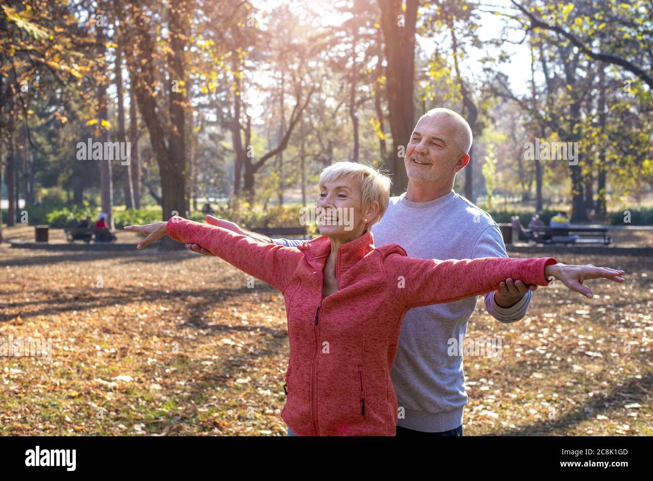 Happy elder couple exercising in a park - romantic concept Stock Photo ...