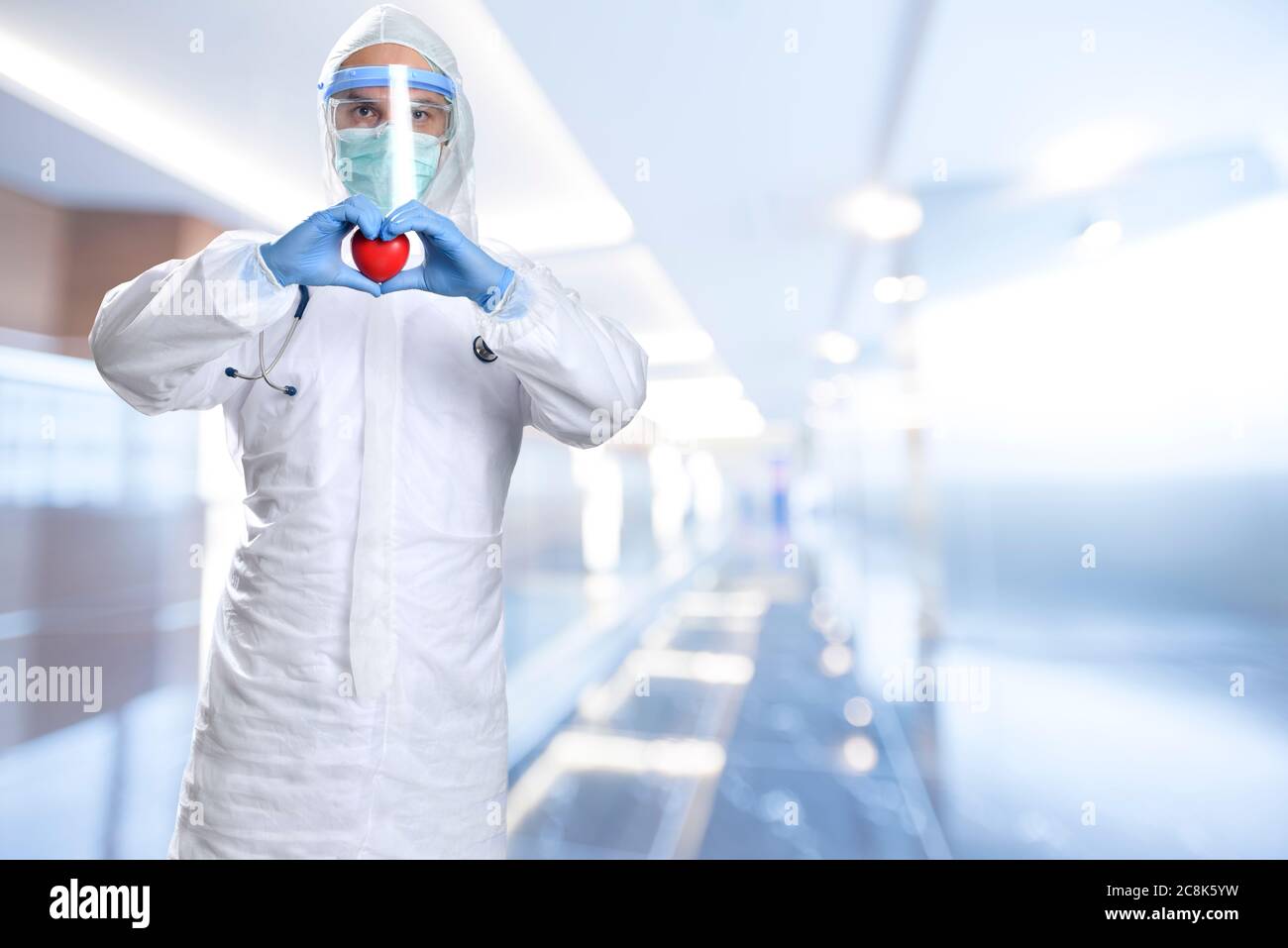 Heart in the hands of medical doctor with copy space for your text Shallow depth of field, selective focus on hand, multiple image collage. Stock Photo