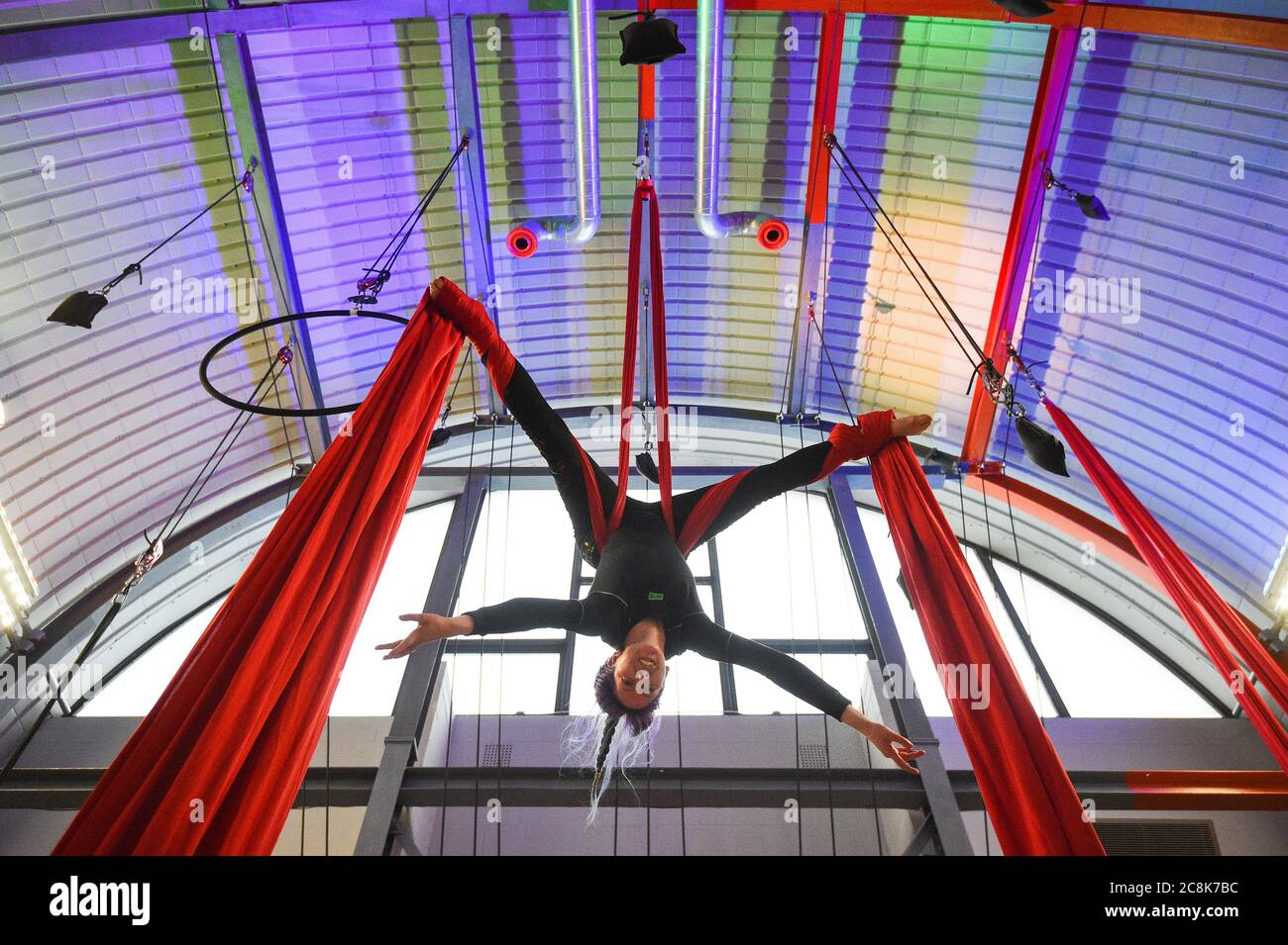An aerialist practices her skills on ribbons at Flying Fantastic in Southwark, London, as indoor gyms, swimming pools and sports facilities can reopen as part of the latest easing of coronavirus lockdown measures in England. Stock Photo