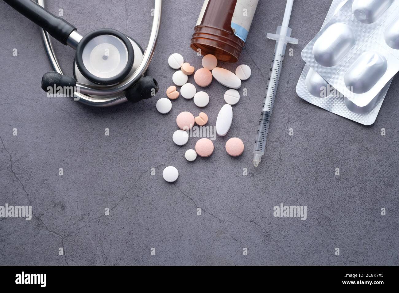 pills , syringe and stethoscope on black background  Stock Photo