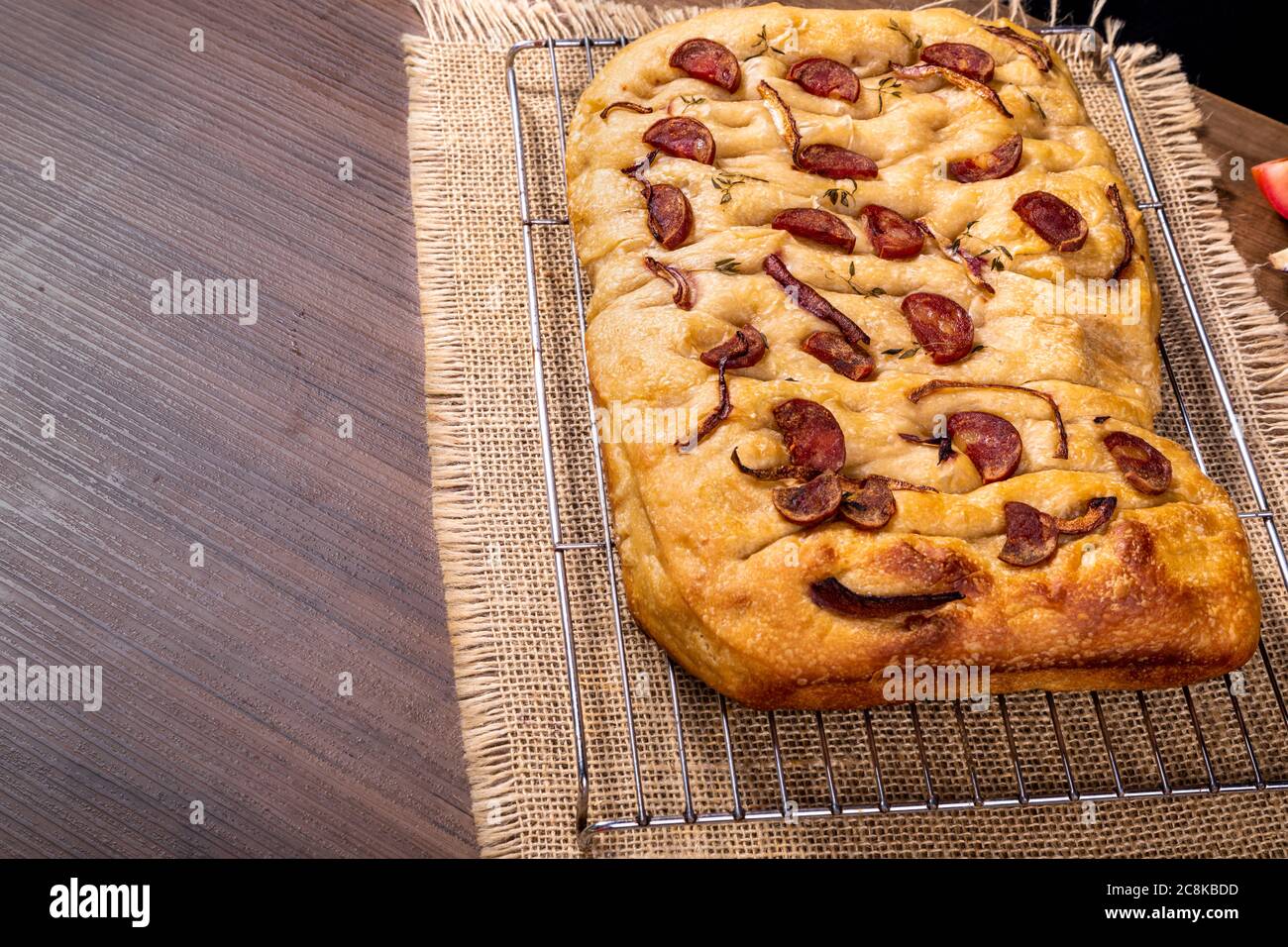 Traditional Italian Focaccia with pepperoni, cherry tomatoes, black