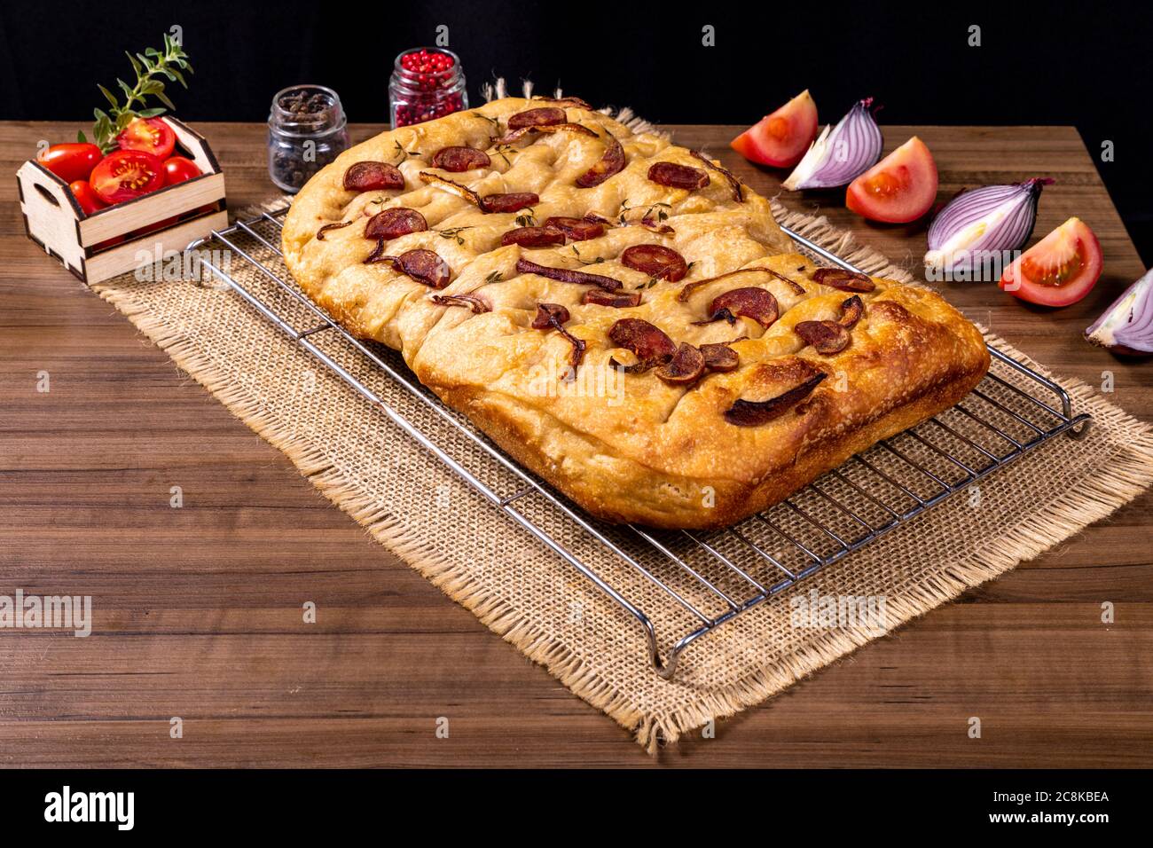 Traditional Italian Focaccia with pepperoni, cherry tomatoes, black