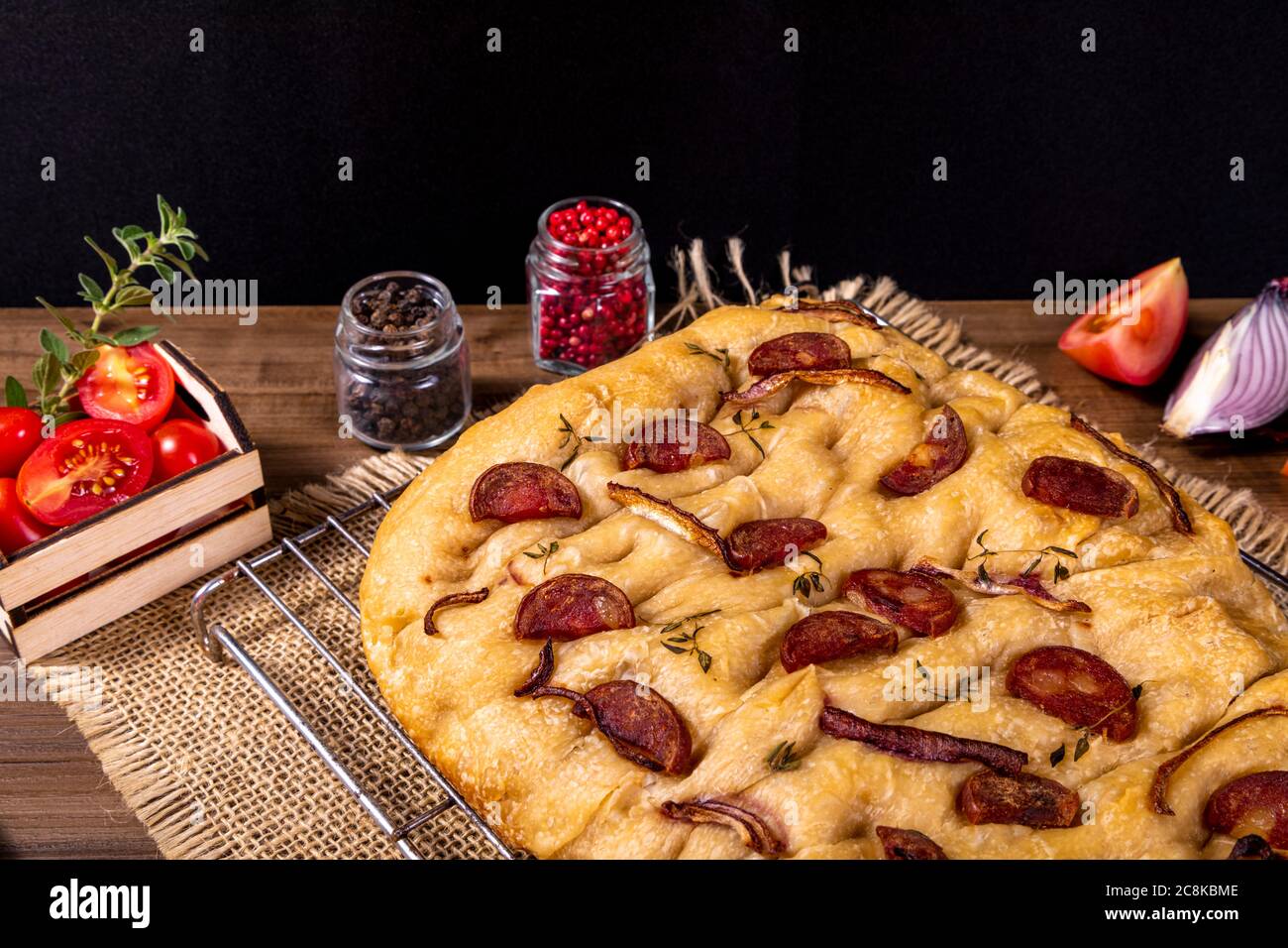 Traditional Italian Focaccia with pepperoni, cherry tomatoes, black