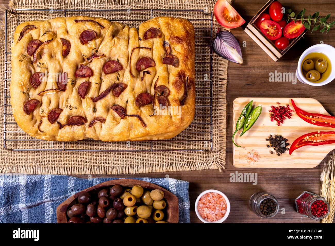 Traditional Italian Focaccia with pepperoni, cherry tomatoes, black