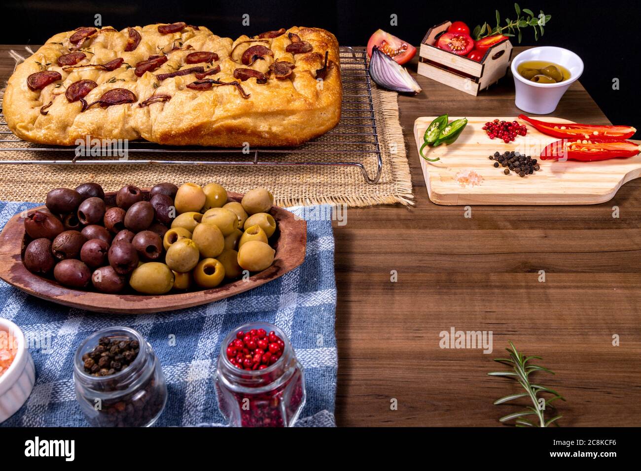 Traditional Italian Focaccia with pepperoni, cherry tomatoes, black