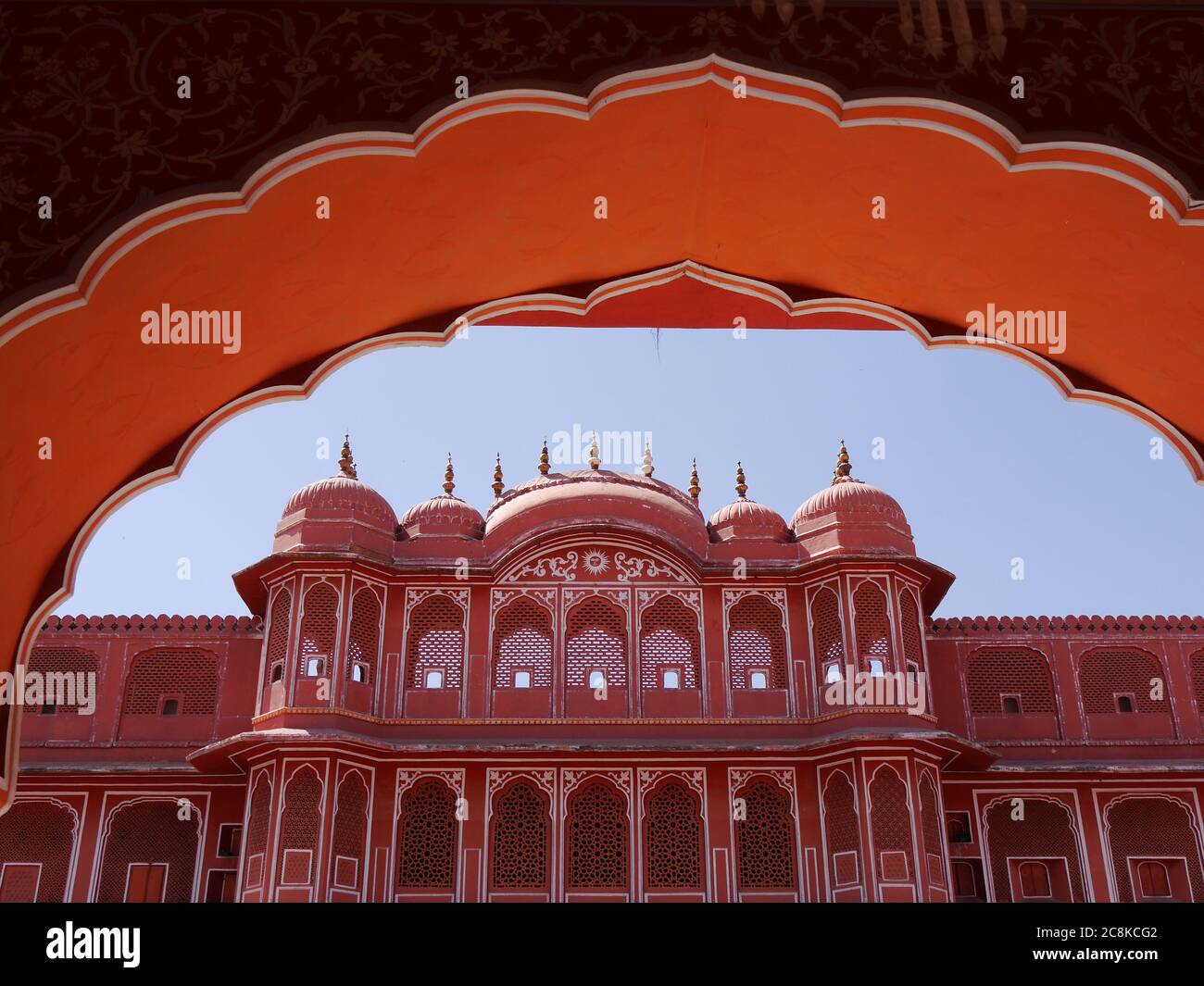 Ornate facade of Amber Fort under orange arch Jaipur, Rajasthan, India Stock Photo