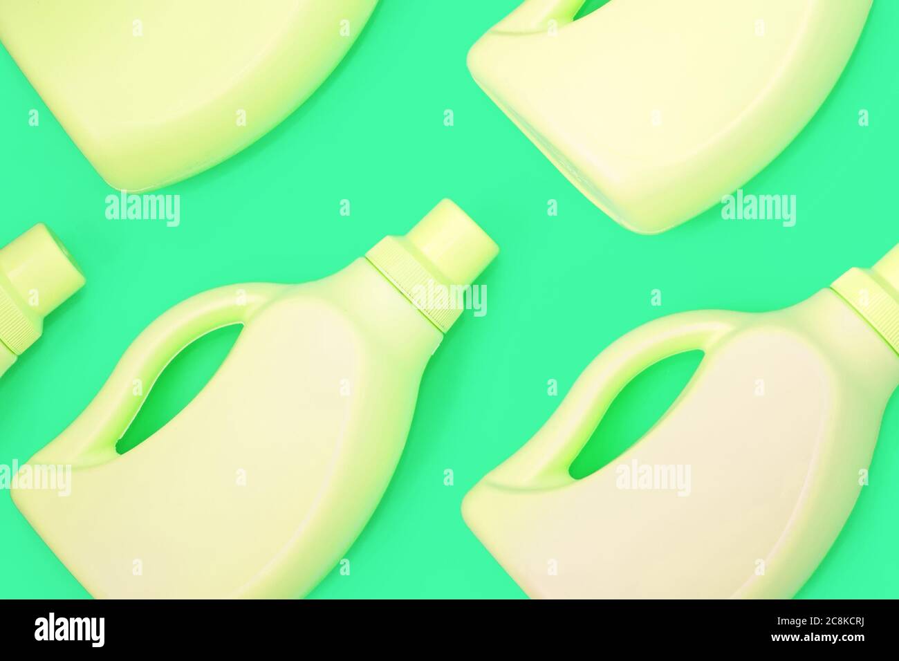 Yellow bottles with chemicals for cleaning on a green background. Seamless pattern. Cleaning