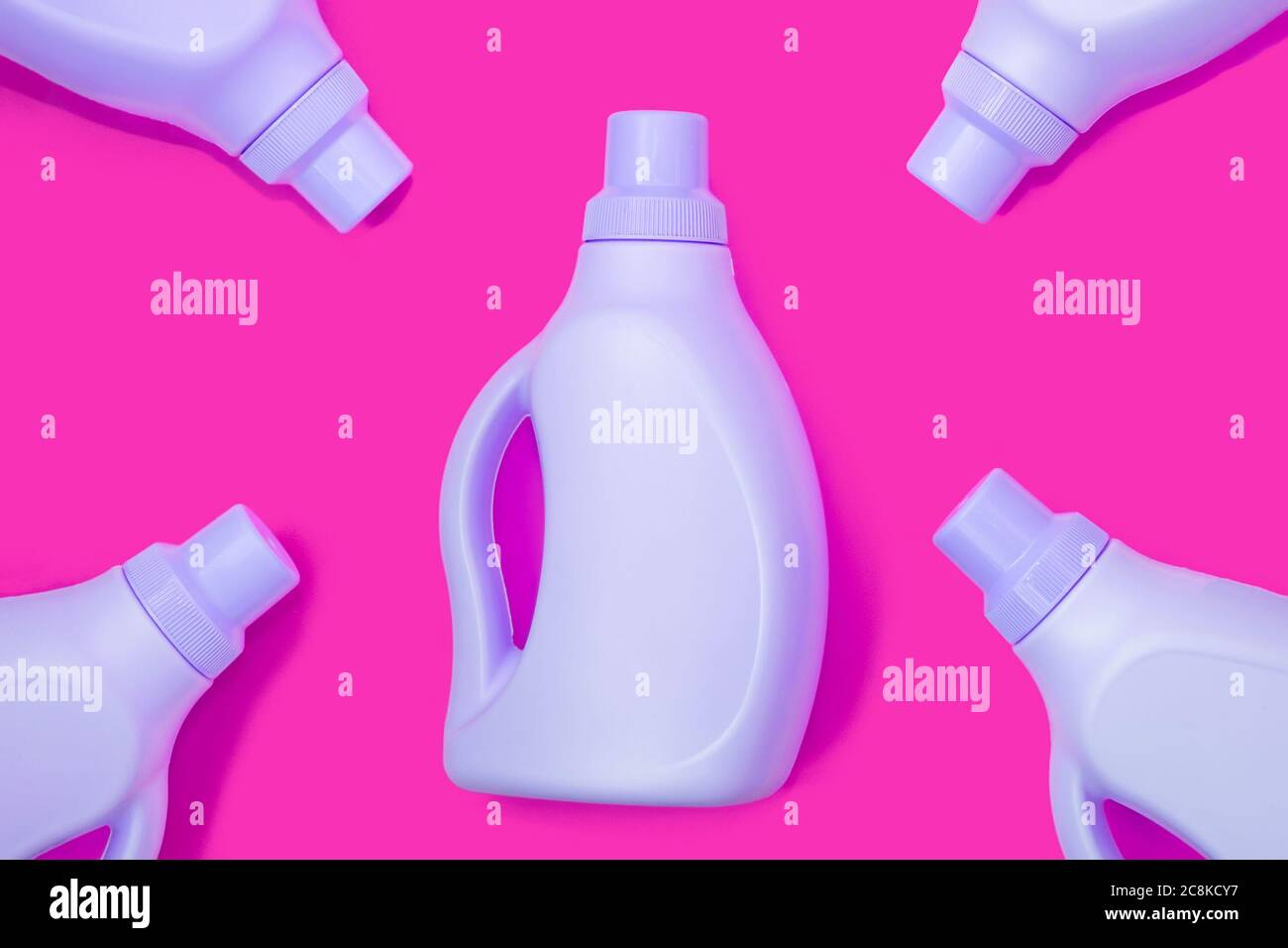 Blue bottles on crimson background. Cleaning concept Stock Photo Alamy