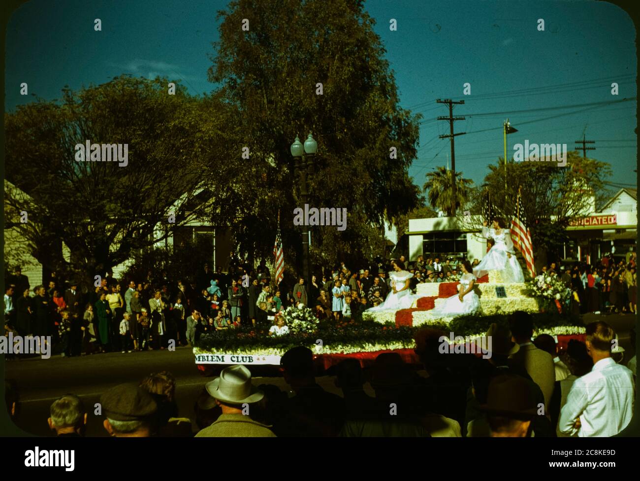 Beauty queens ride the Supreme Emblem Club float during the Veterans Day Parade in Porterville, California in November 1954. Stock Photo