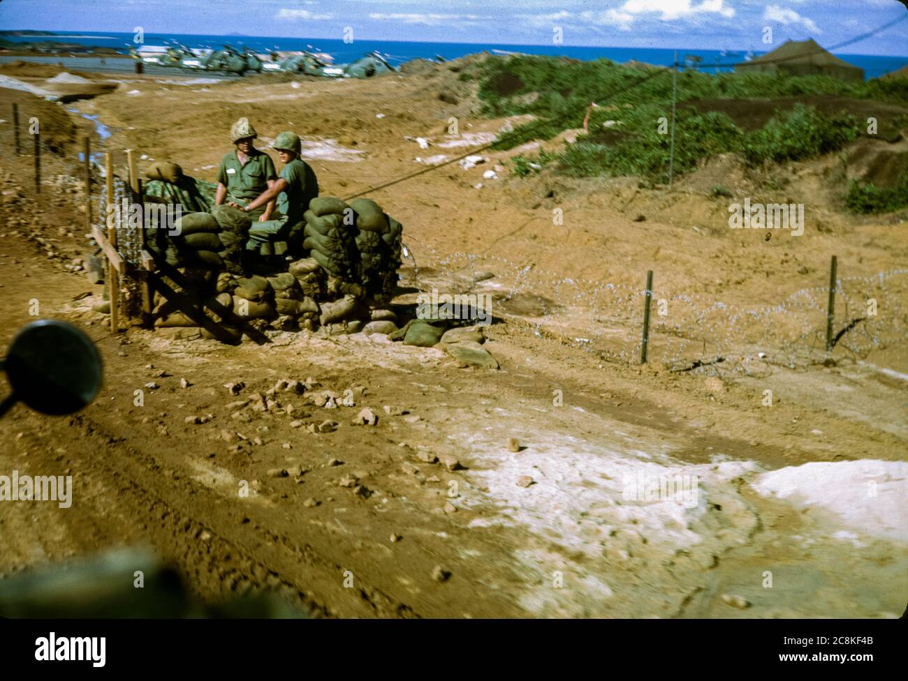 United States Marines man a check point near a helicopter landing pad in 1965 during the Vietnam War. Stock Photo