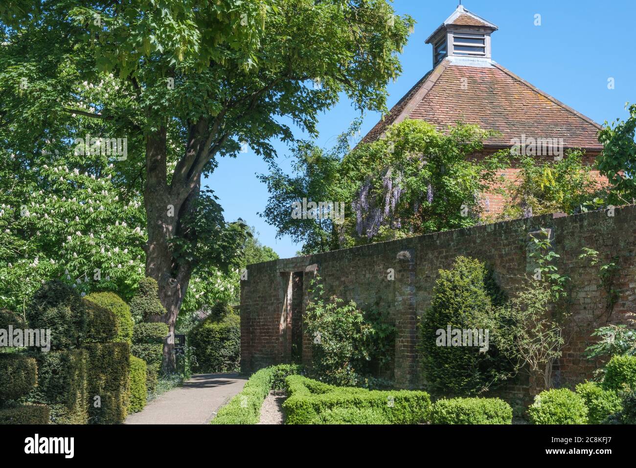 The Topiary Garden with dovecote in background at Eastcote House Gardens, Eastcote Middlesex, Northwest London. Stock Photo