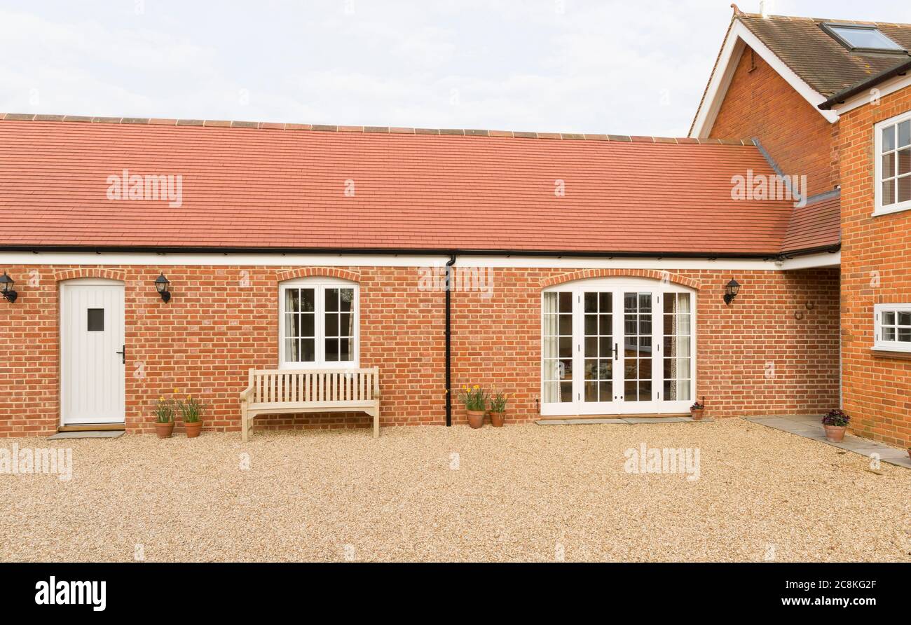 Residential home addition (barn conversion) to provide a single storey annexe to a UK house Stock Photo