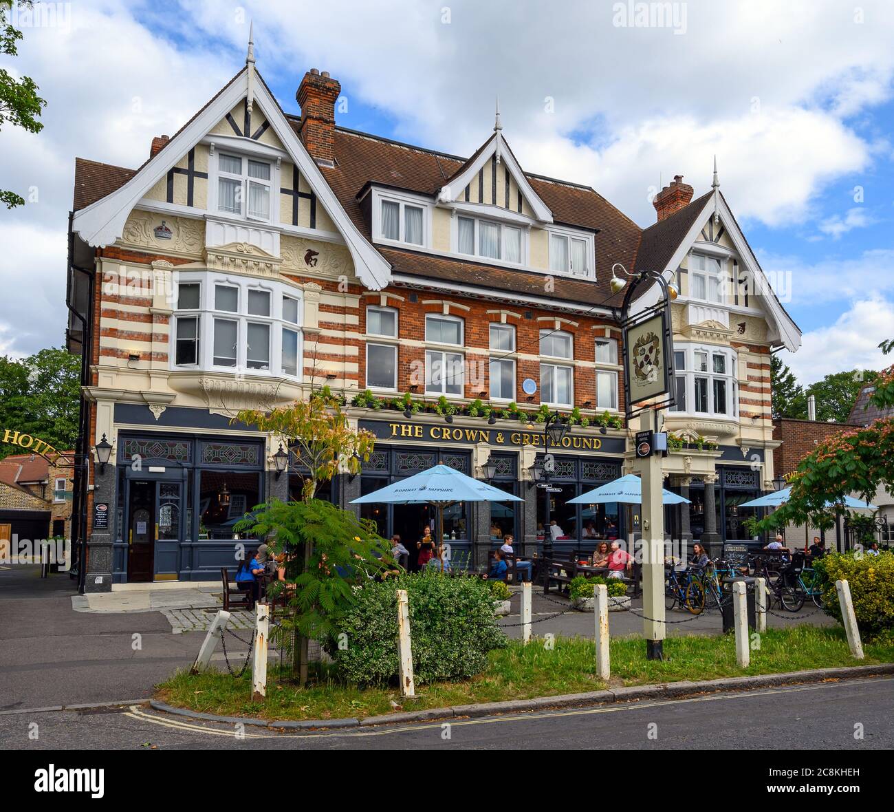 The Crown & Greyhound pub and Dulwich Hotel in Dulwich Village with people sitting outside. Dulwich is in south London. Stock Photo