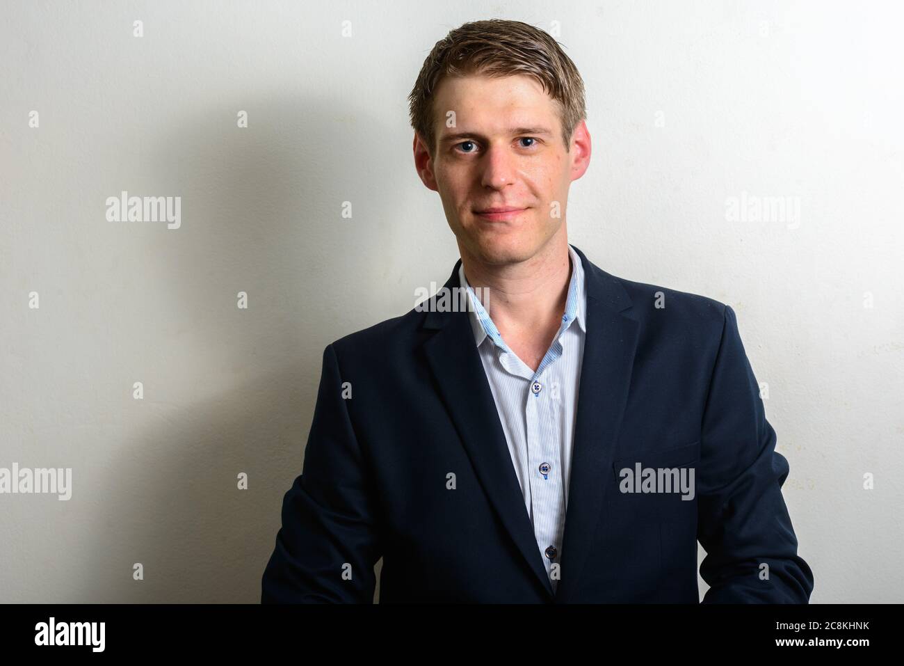 Portrait of young handsome businessman in suit with blond hair Stock ...