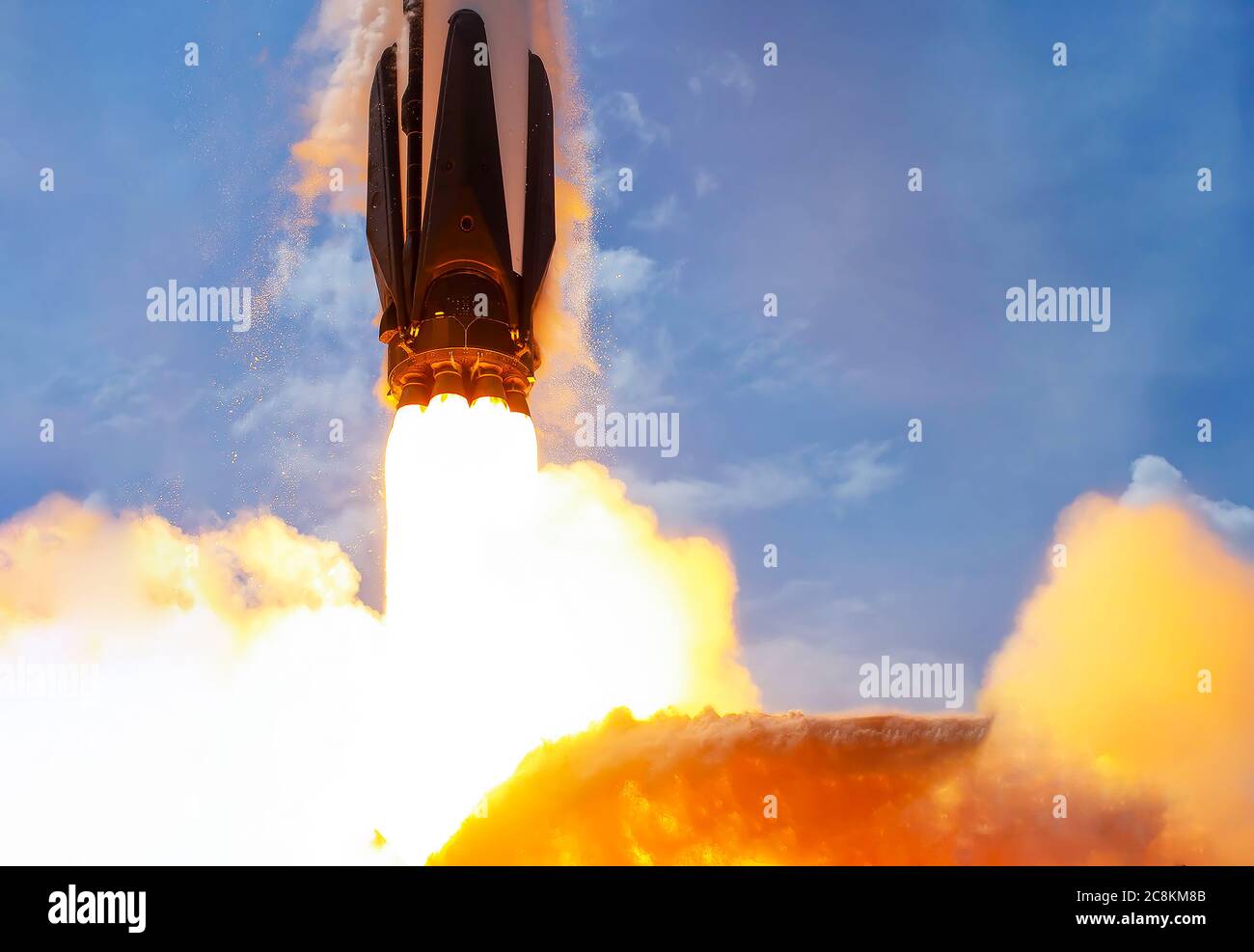 Rocket launch against blue sky close up. Elements of this image were furnished by NASA. Stock Photo