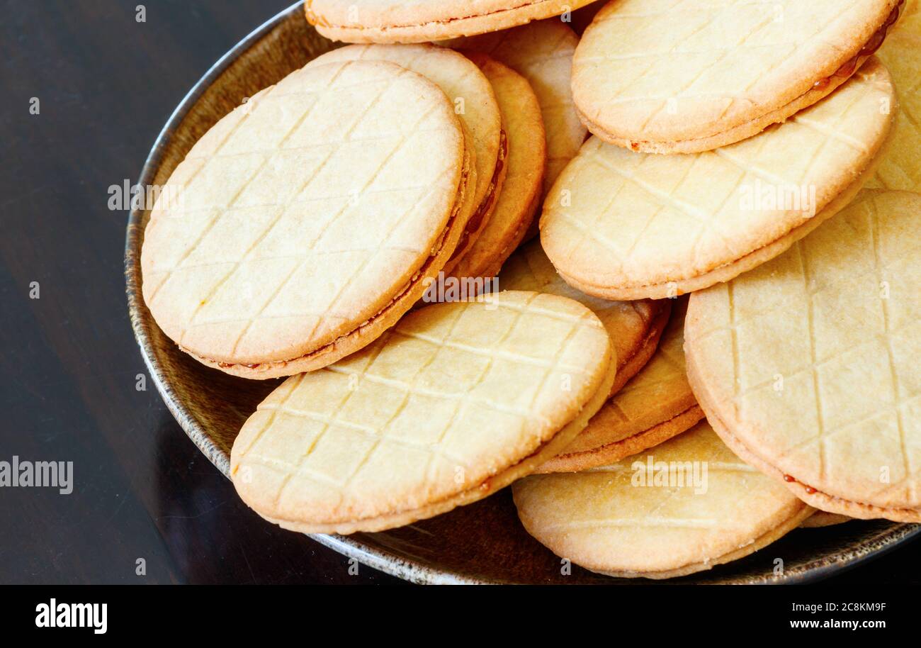 Dish with typical dutch syrup cookies (stroopkoeken) a variant of the famous Gouda syrup waffle (stroopwafels). Stock Photo