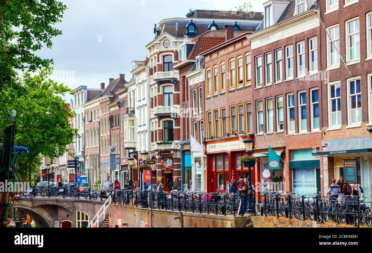 Utrecht city centre. Houses and shops at the Oudegracht (Old Canal) on a sunny morning. The Netherlands. Stock Photo