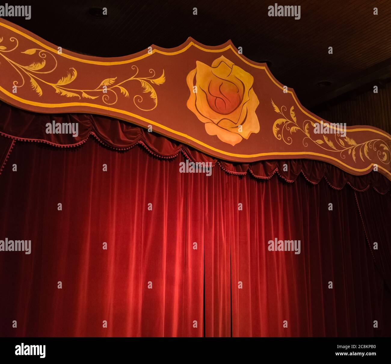 Stage with red curtains and a yellow rose. stage for shows Stock Photo