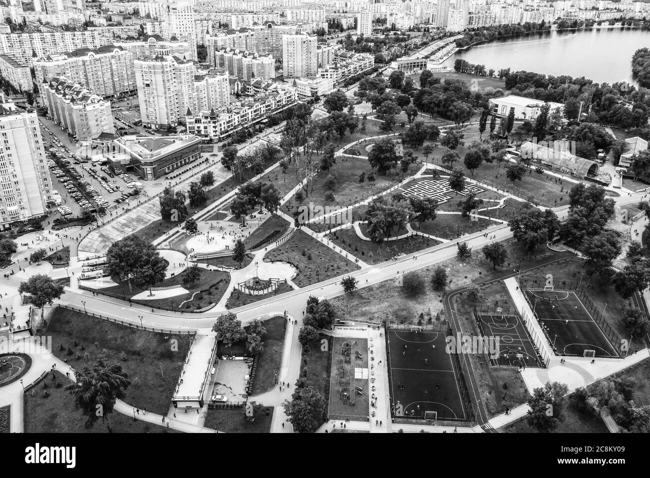 Aerial view of green Natalka Park in Obolon area in Kyiv city, Ukraine. Flying drone camera shot. Stock Photo