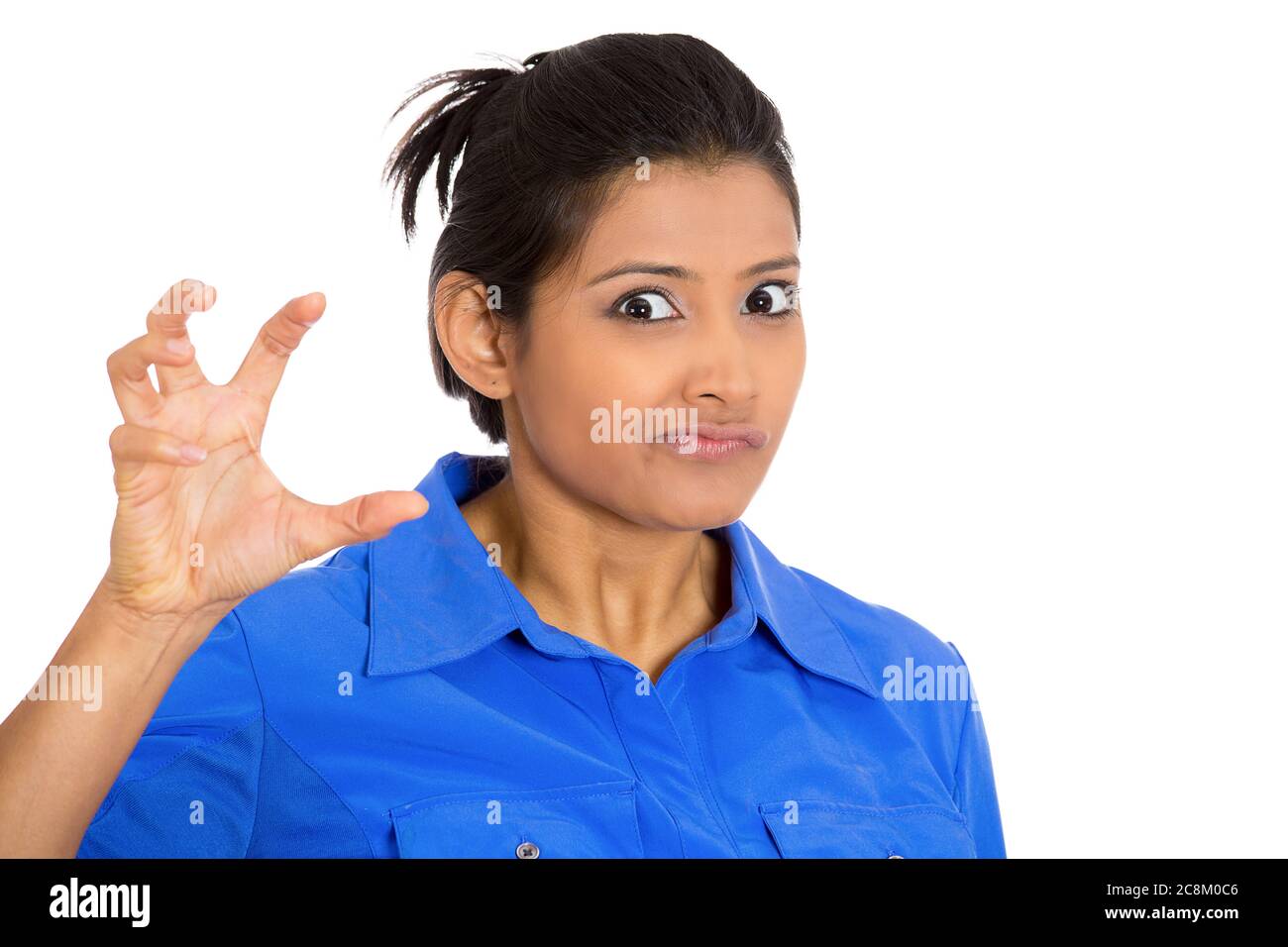 Portrait of an irritated, angry mad young woman, threatening someone with her nails isolated on white background. Stock Photo