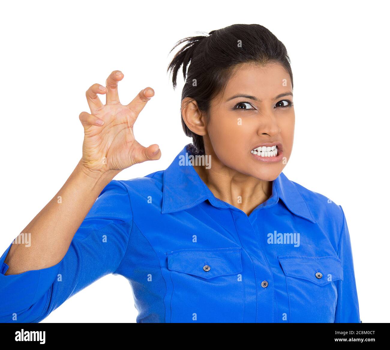 Portrait of an irritated, angry mad young woman, threatening someone with her nails isolated on white background. Stock Photo