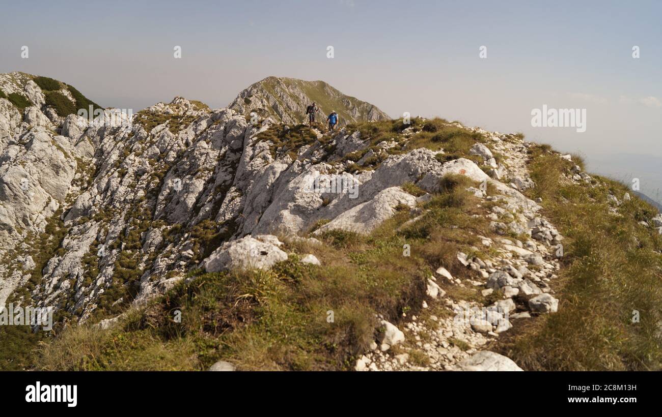 Rocky path with hikers Stock Photo