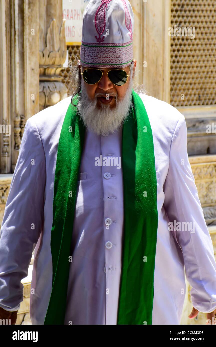 New Delhi India – March 13 2020 : Man Inside Hazrat Nizamuddin Dargah during the day time in Delhi India, Religious Darah of Nizamuddin in Delhi durin Stock Photo