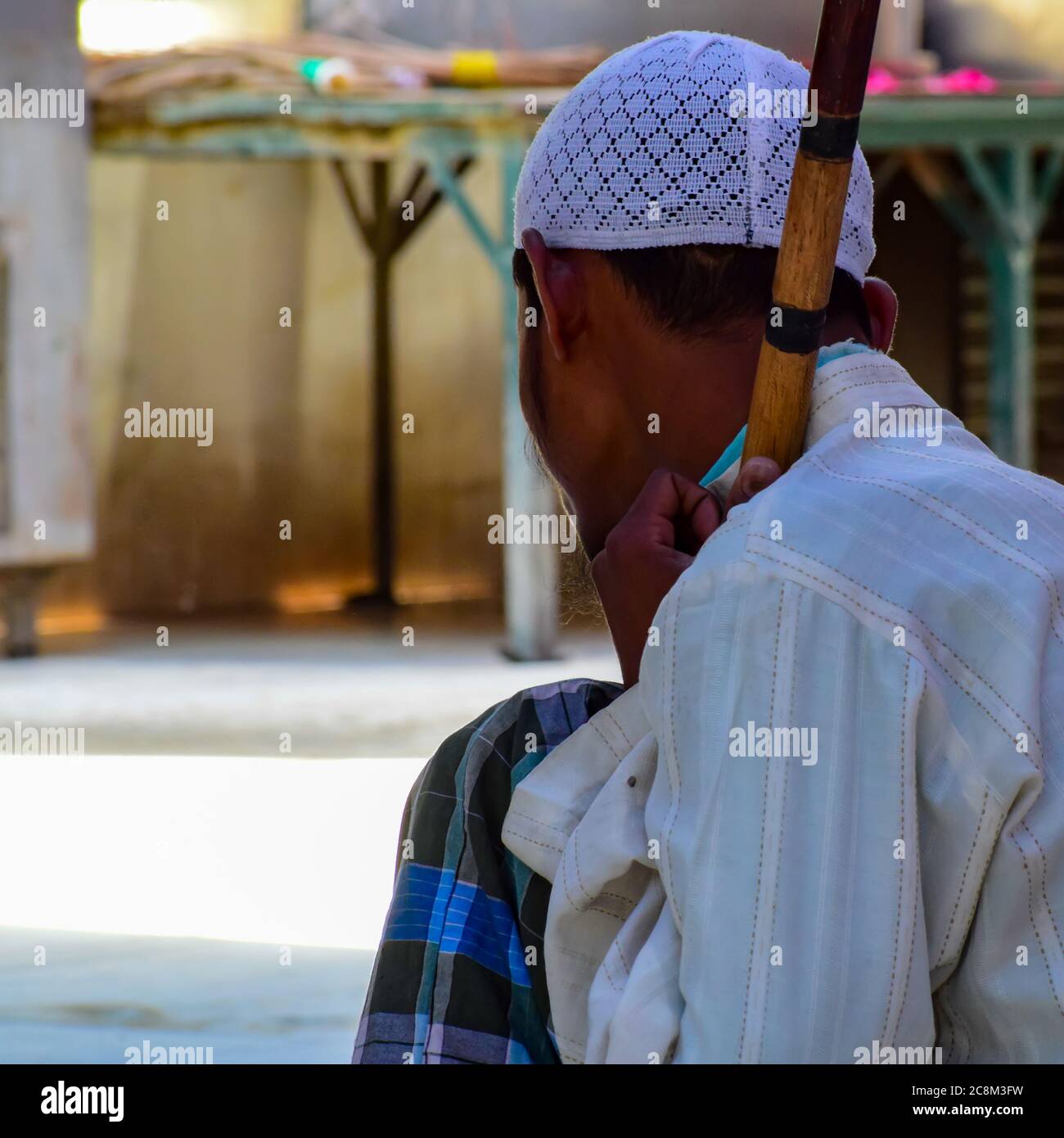 New Delhi India – March 13 2020 : Man Inside Hazrat Nizamuddin Dargah during the day time in Delhi India, Religious Darah of Nizamuddin in Delhi durin Stock Photo