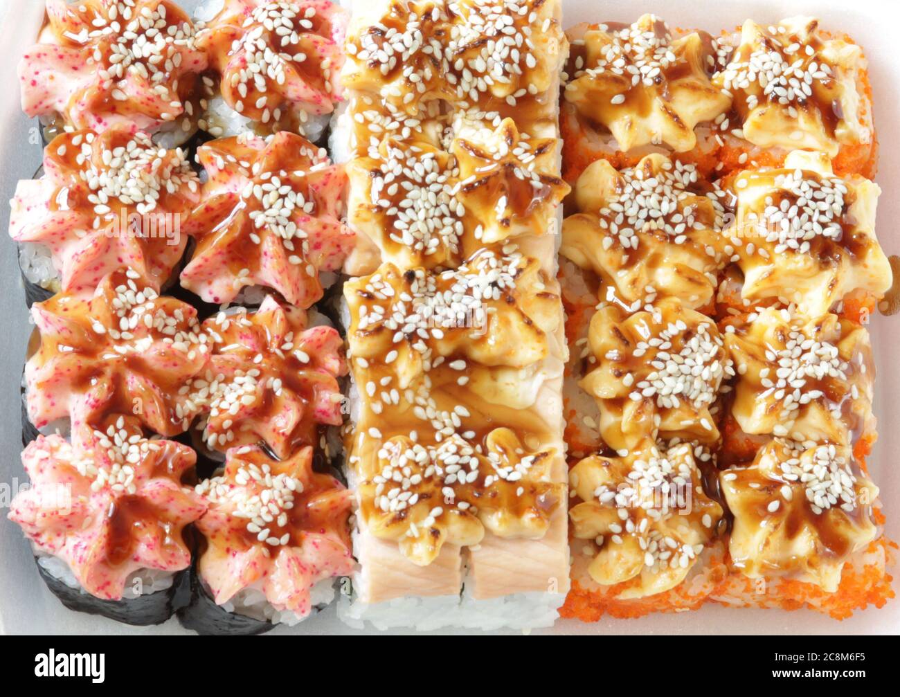 Japanese sushi food. Baked warm rolls with tuna, salmon, shrimp, crab