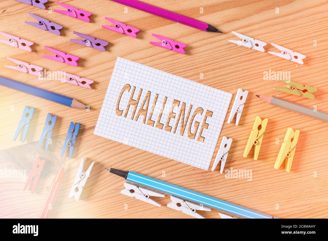 Conceptual hand writing showing Challenge. Concept meaning process of provoking or testing physiological activity by exposure Colored crumpled papers Stock Photo