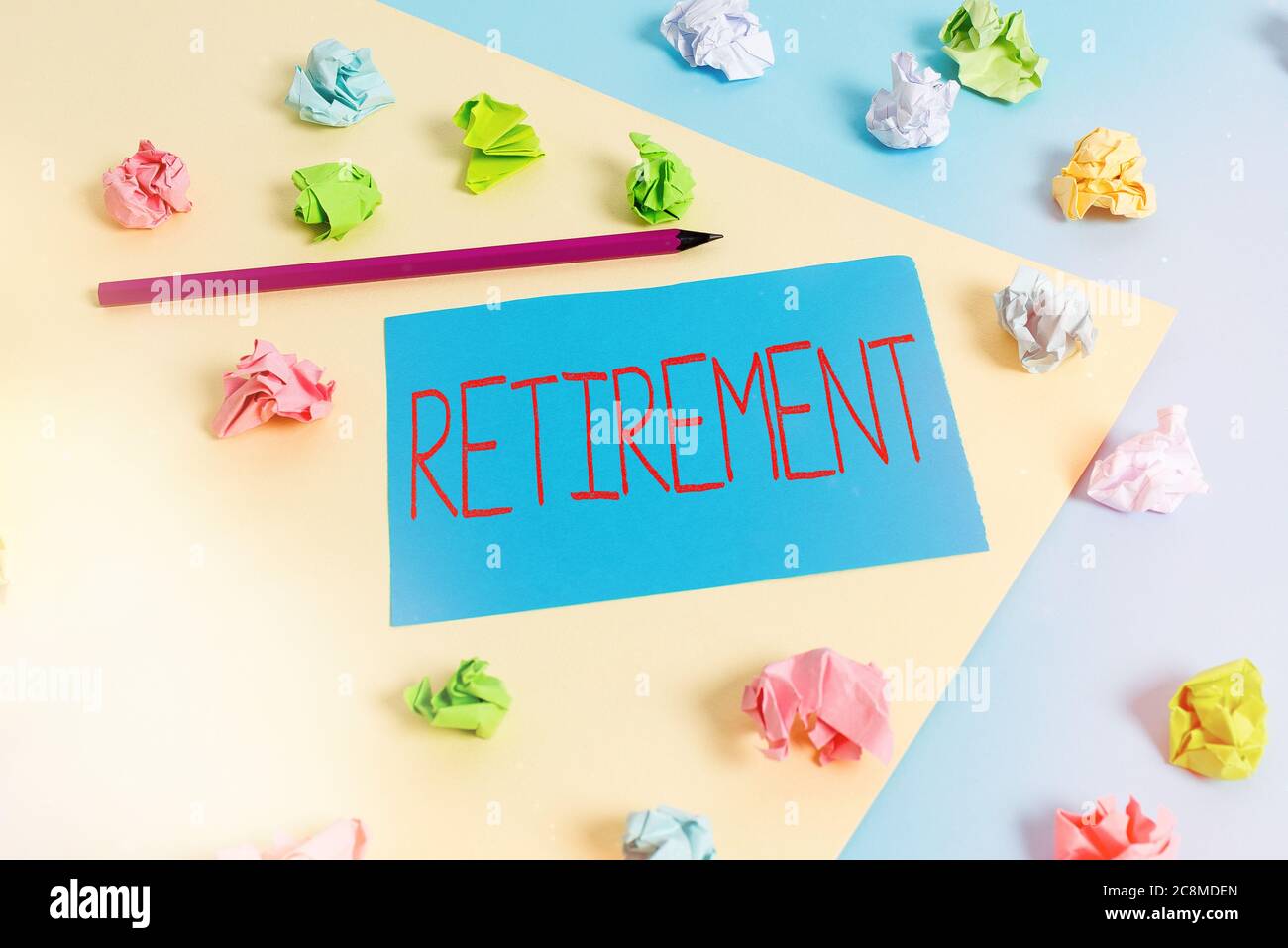 Writing note showing Retirement. Business concept for withdrawal from one s is occupation or from active working life Colored crumpled papers empty re Stock Photo