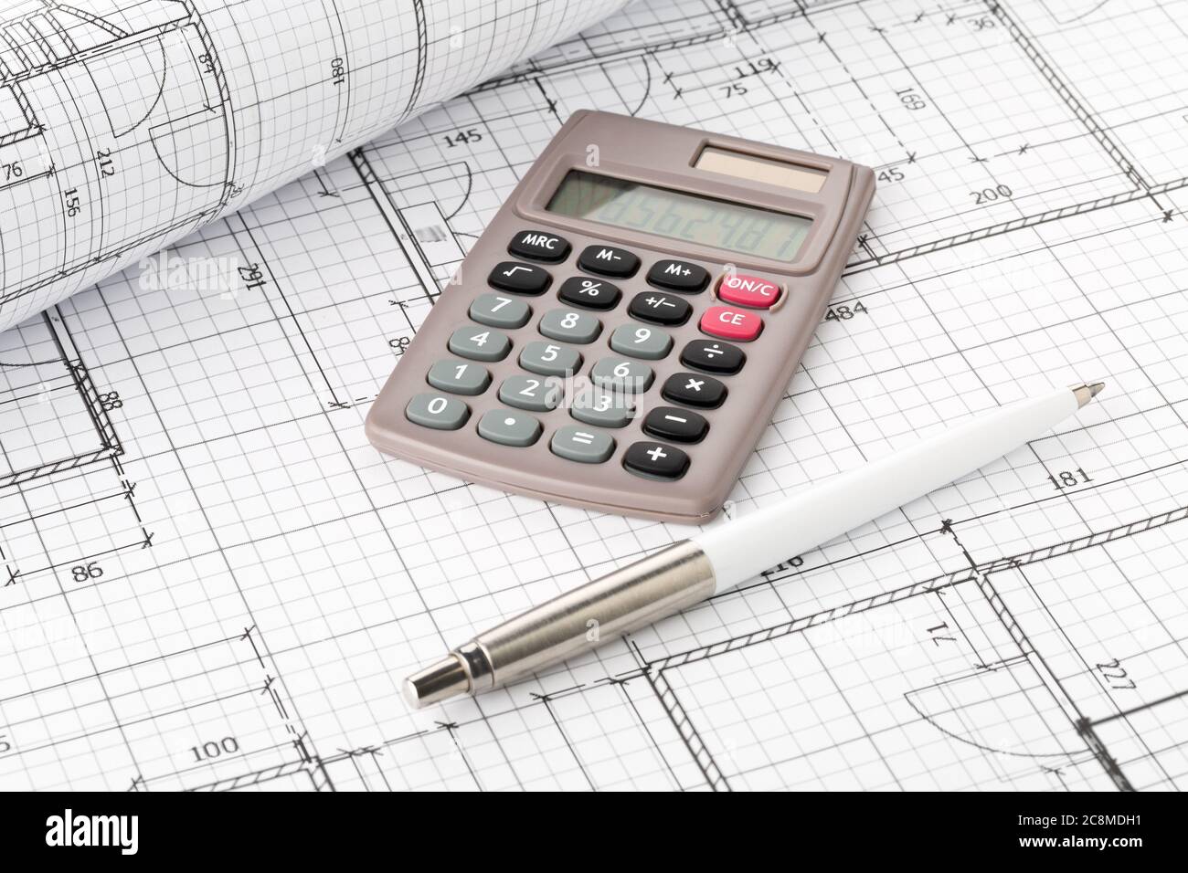 Calculator with pen on architectural house building blueprint plan  background, real estate or house building costs concept Stock Photo - Alamy