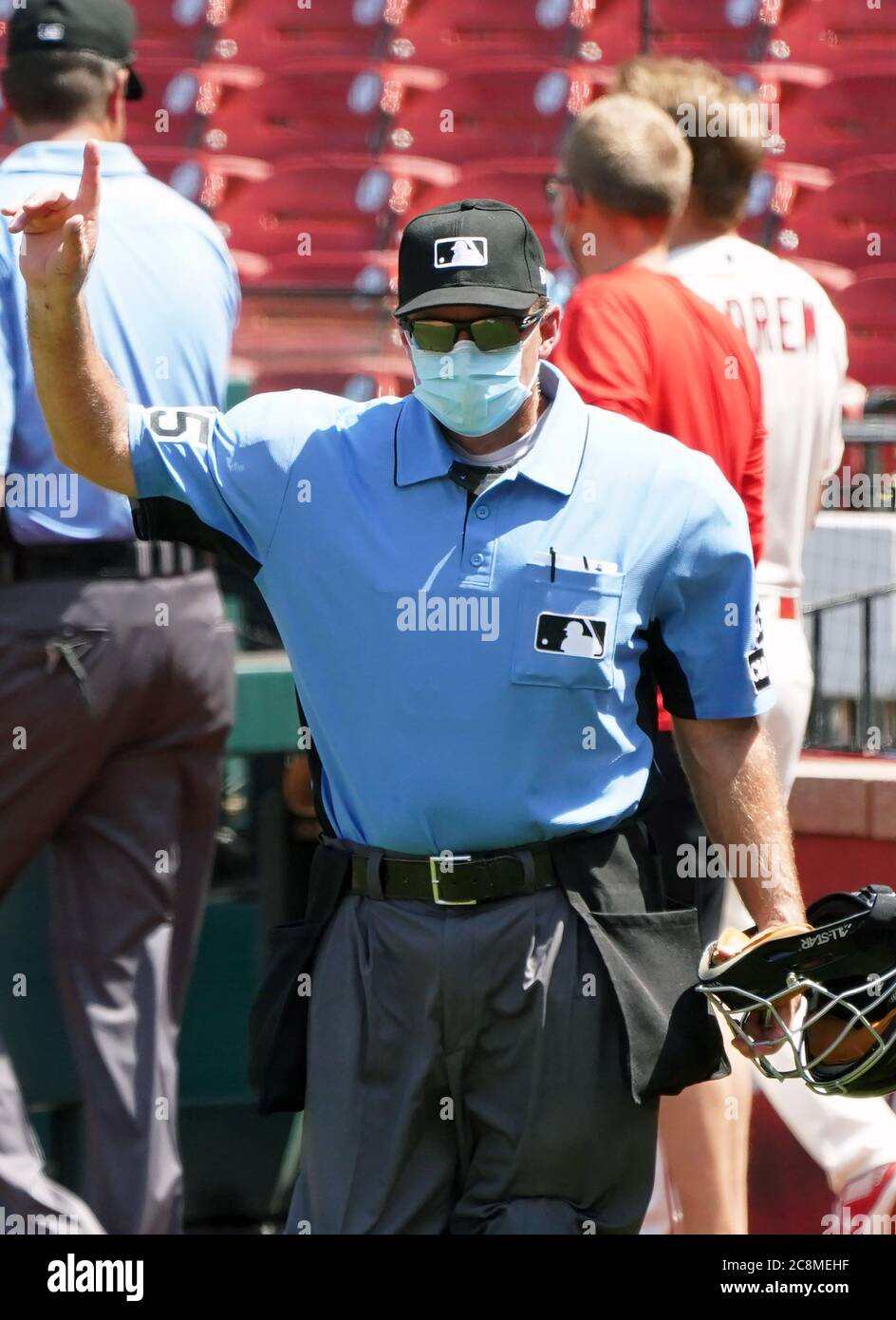 St. Louis, United States. 25th July, 2020. Home plate umpire Ed Hickox signals how many warm up pitches the Pittsburgh Pirates pitcher has before the fifth inning resumes against the St. Louis Cardinals at Busch Stadium in St. Louis on Saturday, July 25, 2020. Photo by Bill Greenblatt/UPI Credit: UPI/Alamy Live News Stock Photo