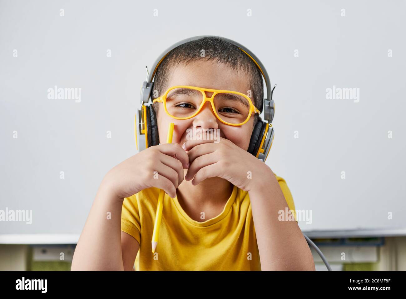 A portrait of middle-eastern schoolboy in headphones Stock Photo - Alamy